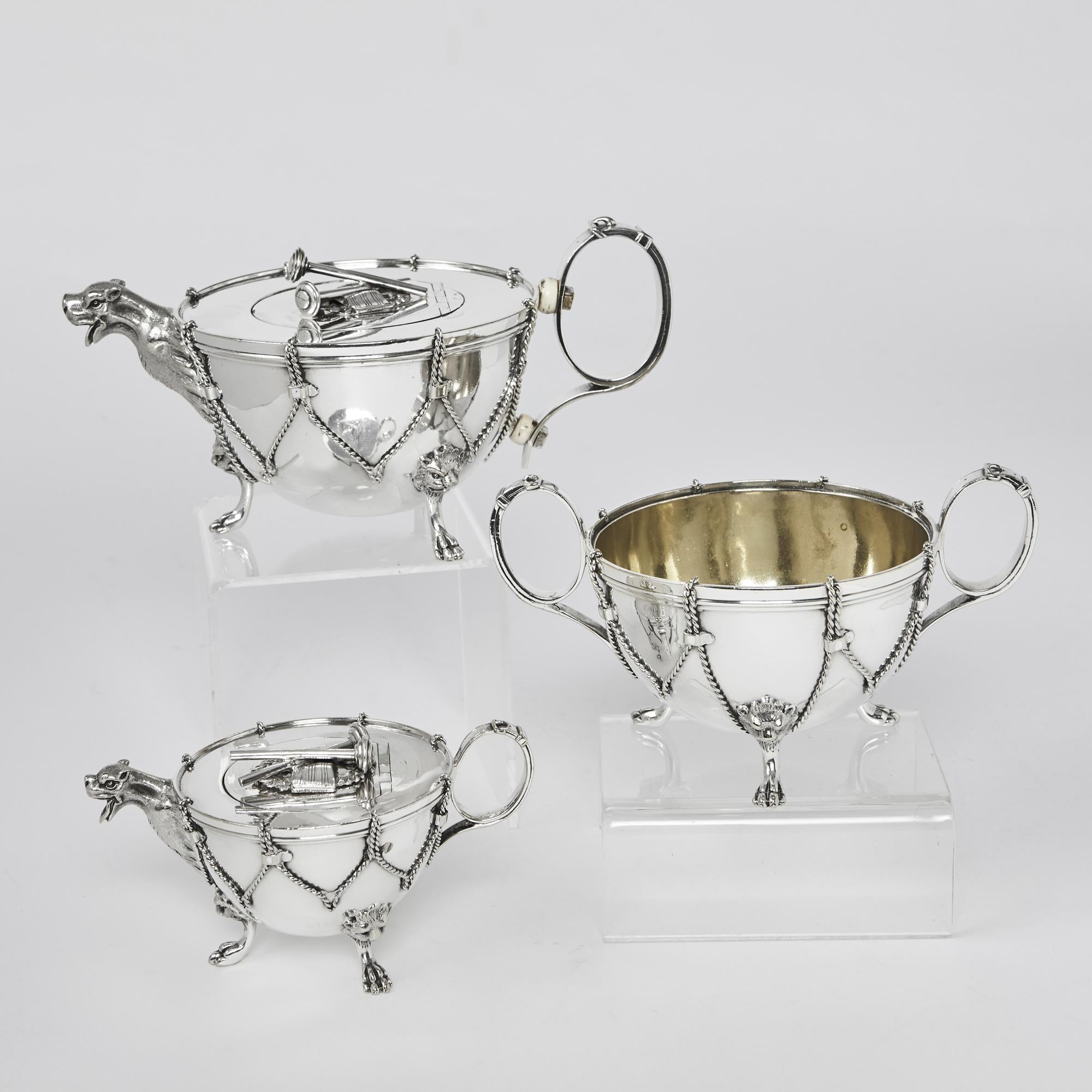Exceptional and rare, possibly unique, three-piece, silver-plated tea set, comprising a teapot, milk jug and sugar bowl, all authentically modelled as military kettle drums with applied rope-effect mouldings.

Each piece of this silver-plated tea