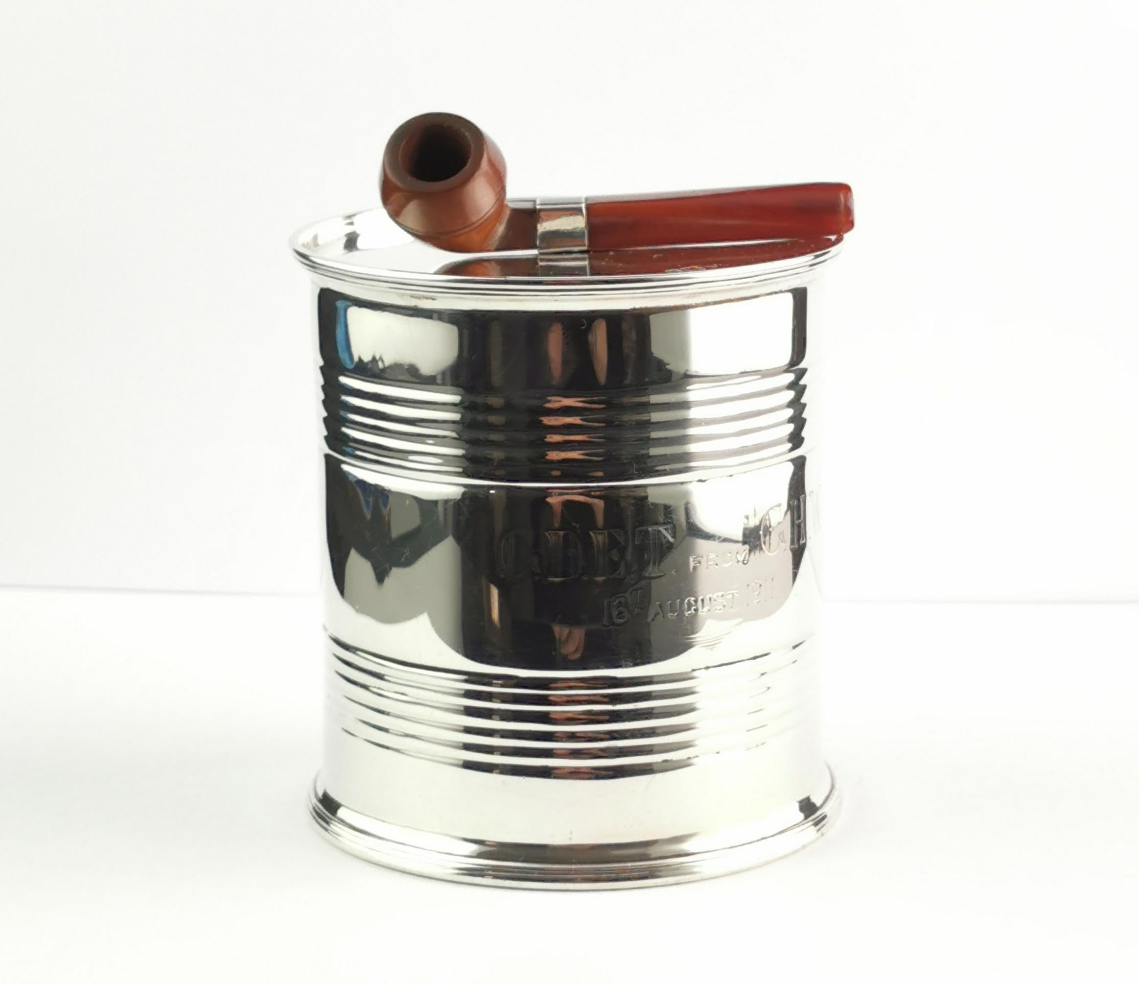 A fantastic and rare, novelty, antique sterling silver tobacco tin or box.

It has been designed as an empty tin can, very realistically detailed and similar in size to a regular food can.

It has a lift off lid, also in sterling silver with a