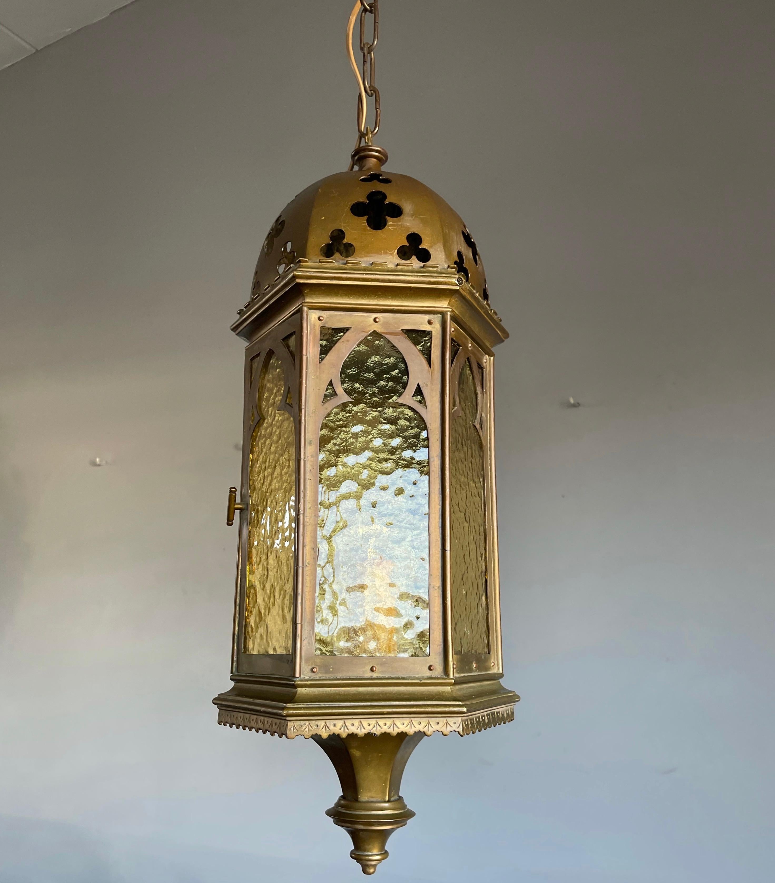 All handcrafted, hexagonal bronze and brass Gothic light fixture.

If you are a collector of rare and ancient looking Gothic antiques then this good size and one of a kind pendant could be flying your way soon. With antique light fixtures as one of