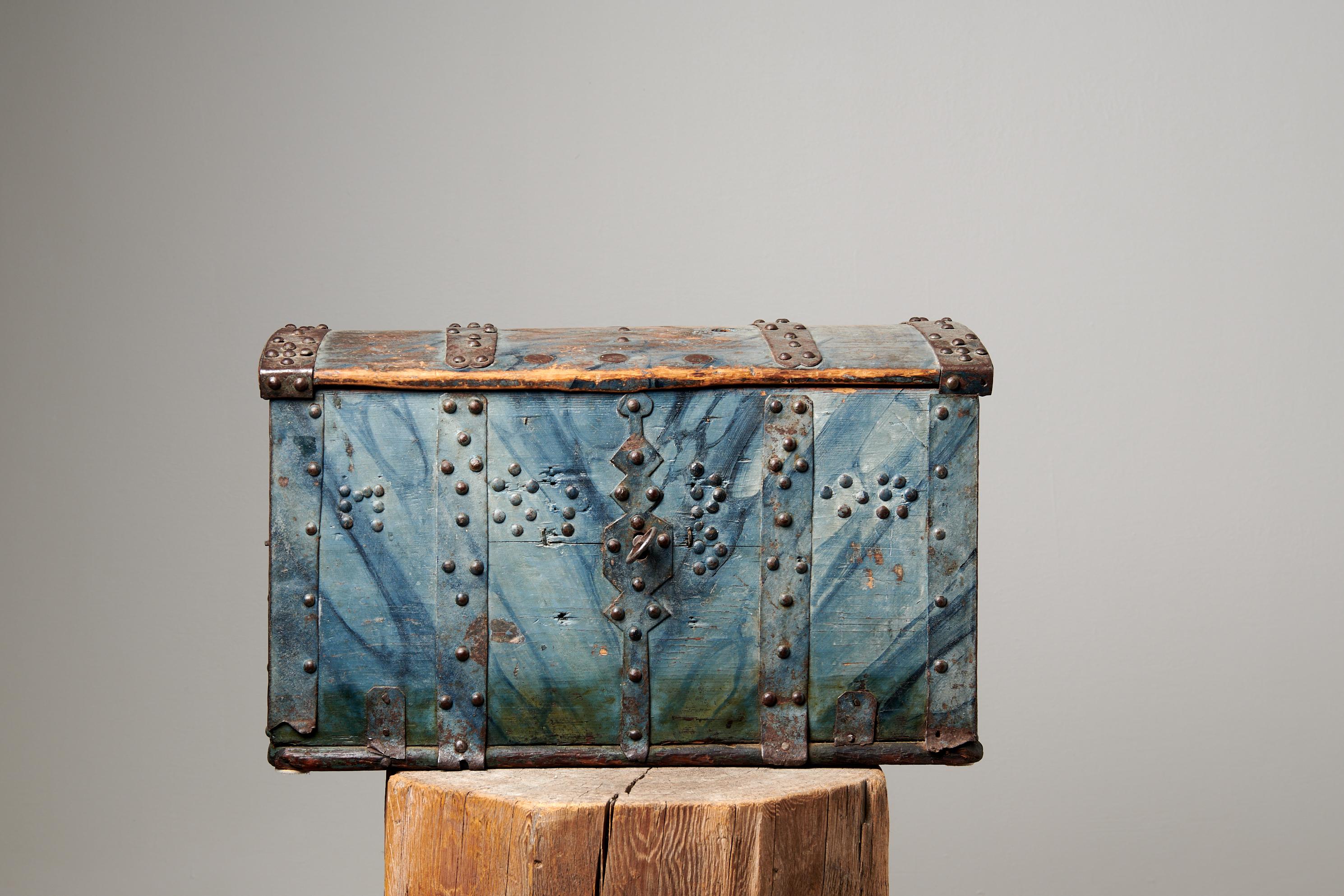 Antique blue marbled chest from northern Sweden made during the late 1700s. The chest is very unusual and in untouched original condition. Made in pine with working lock and key. The chest has plenty of handwrought iron reinforcements which