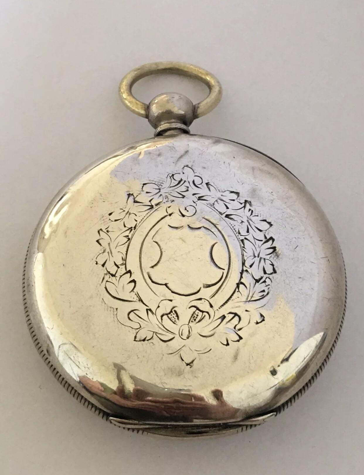 A very beautifully swiss made silver pocket watch. This late 19th century swiss silver pocket watch has a swift second hand and a mock pendulum aperture with a lovely hand painted enamel dial of a man in the country side. the watch has a spring