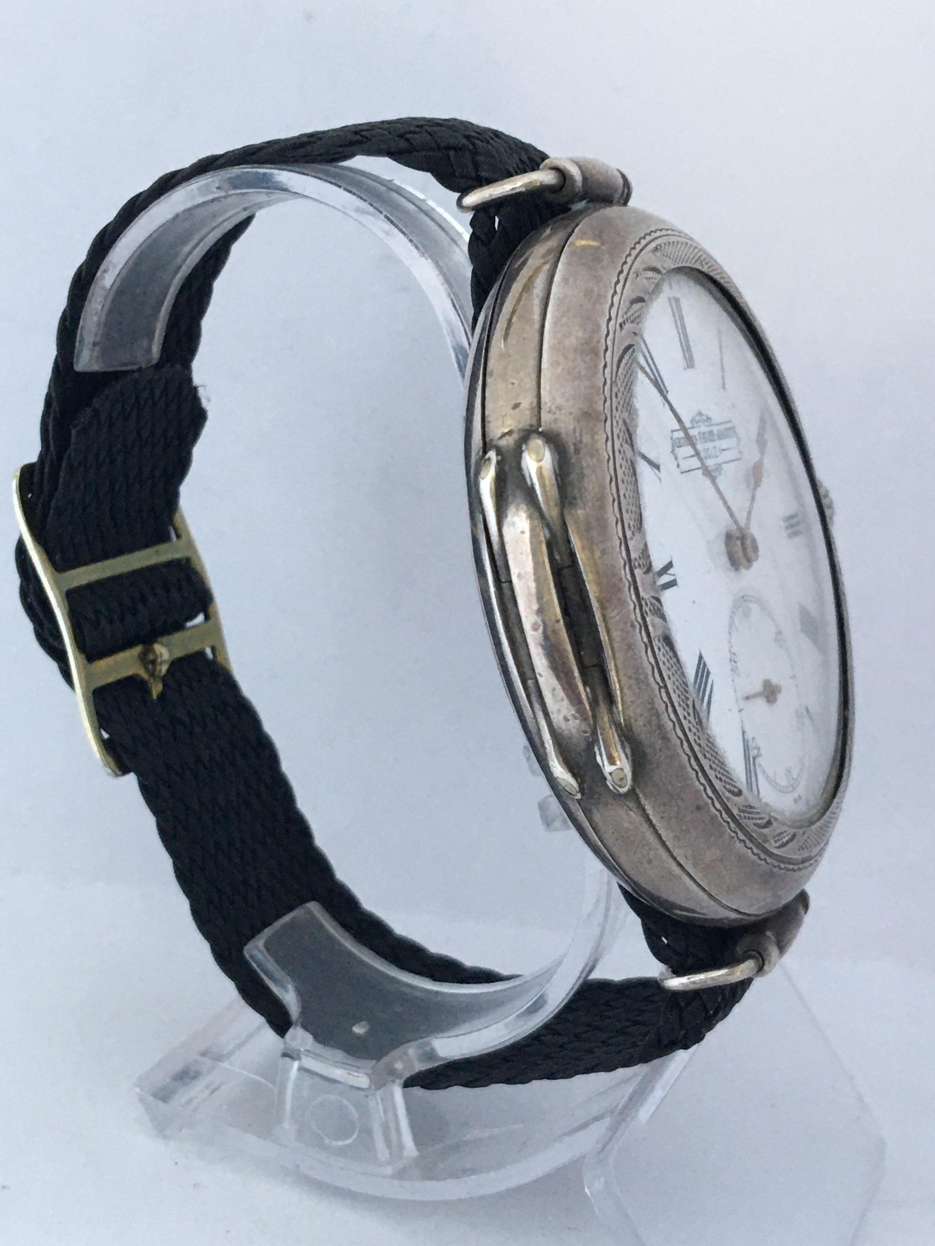 This fine and rare antique Georges Favre-Jacot Locle Silver Trench watch is in good working condition and it is running well. Visible signs of wear and ageing with minor dents at the back cover silver case.

this watch is 55mm diameter without the