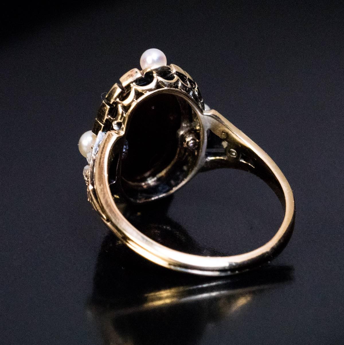 Circa 1860

This rare antique Victorian era gold ring features a finely carved agate cameo depicting Alexander the Great wearing a plumed helmet and chest armour. The cameo is set in a pearl and rose cut diamond frame.

Size of the cameo 14 x 9 mm