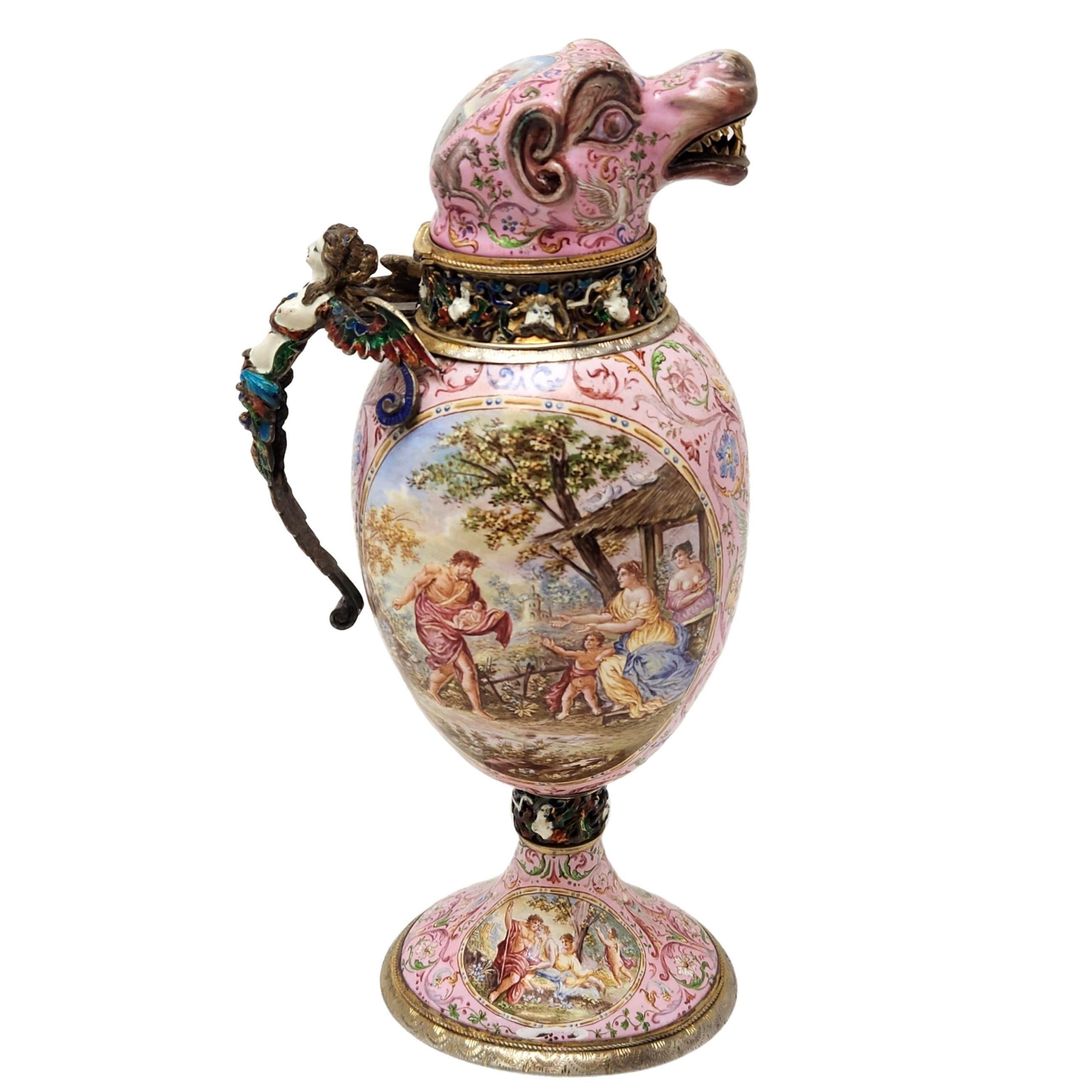 An exceptional Antique 19th Century Viennese Enamel & Silver Jug with exquisitely detailed enamel detailing covering the exterior of the jug. The lid of the jug features a rare bestial head with gilt teeth on a pink enamel background.  The Jug has a