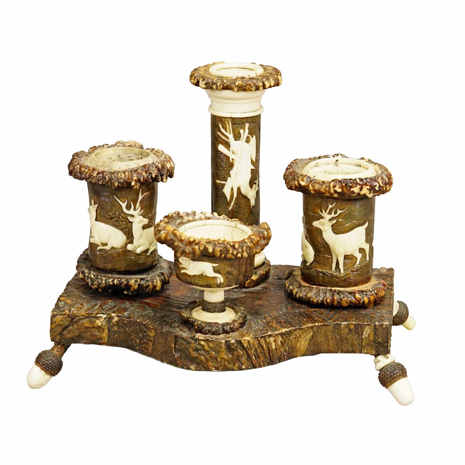 Rare Antler Desk Standish with Elaborate Carvings, Germany ca. 1840

A rare antique writing desk set made of wood and original antlers decorated with fine carved hunting scenes depicting deer families, game and staghond. The wooden base is
