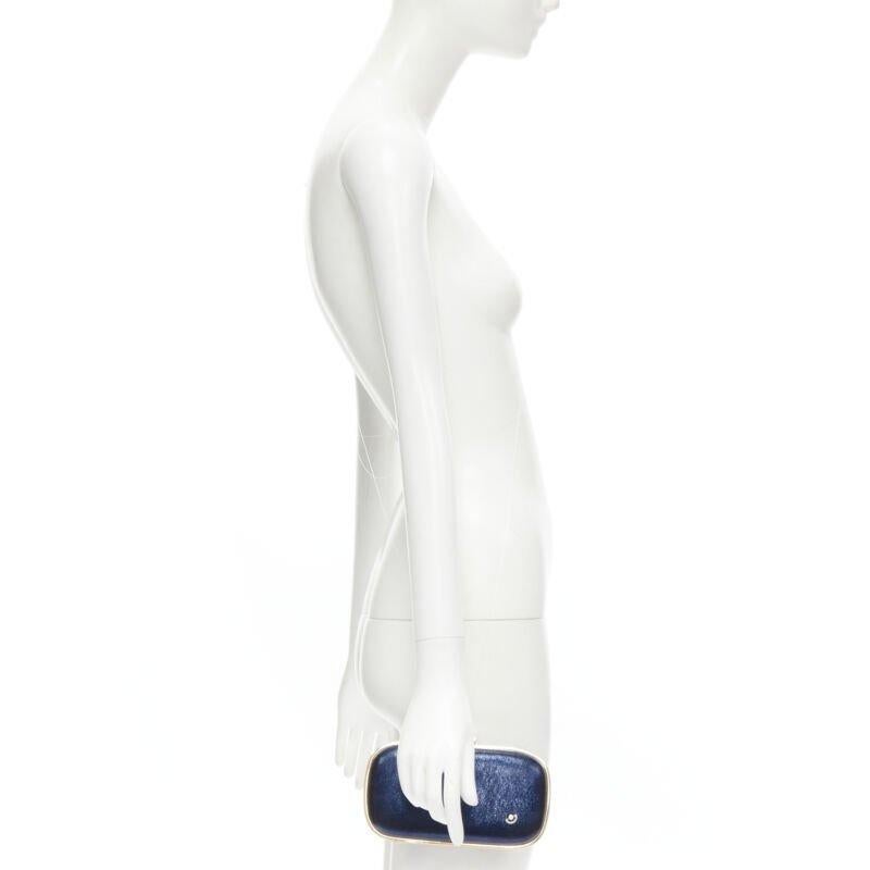 rare ANYA HINDMARCH Marano Music Box metallic blue leather gold frame box clutch
Reference: TACW/A00024
Brand: Anya Hindmarch
Model: Marano Music Box
Material: Leather, Metal
Color: Blue, Gold
Pattern: Solid
Closure: Clasp
Lining:  Suede
Extra
