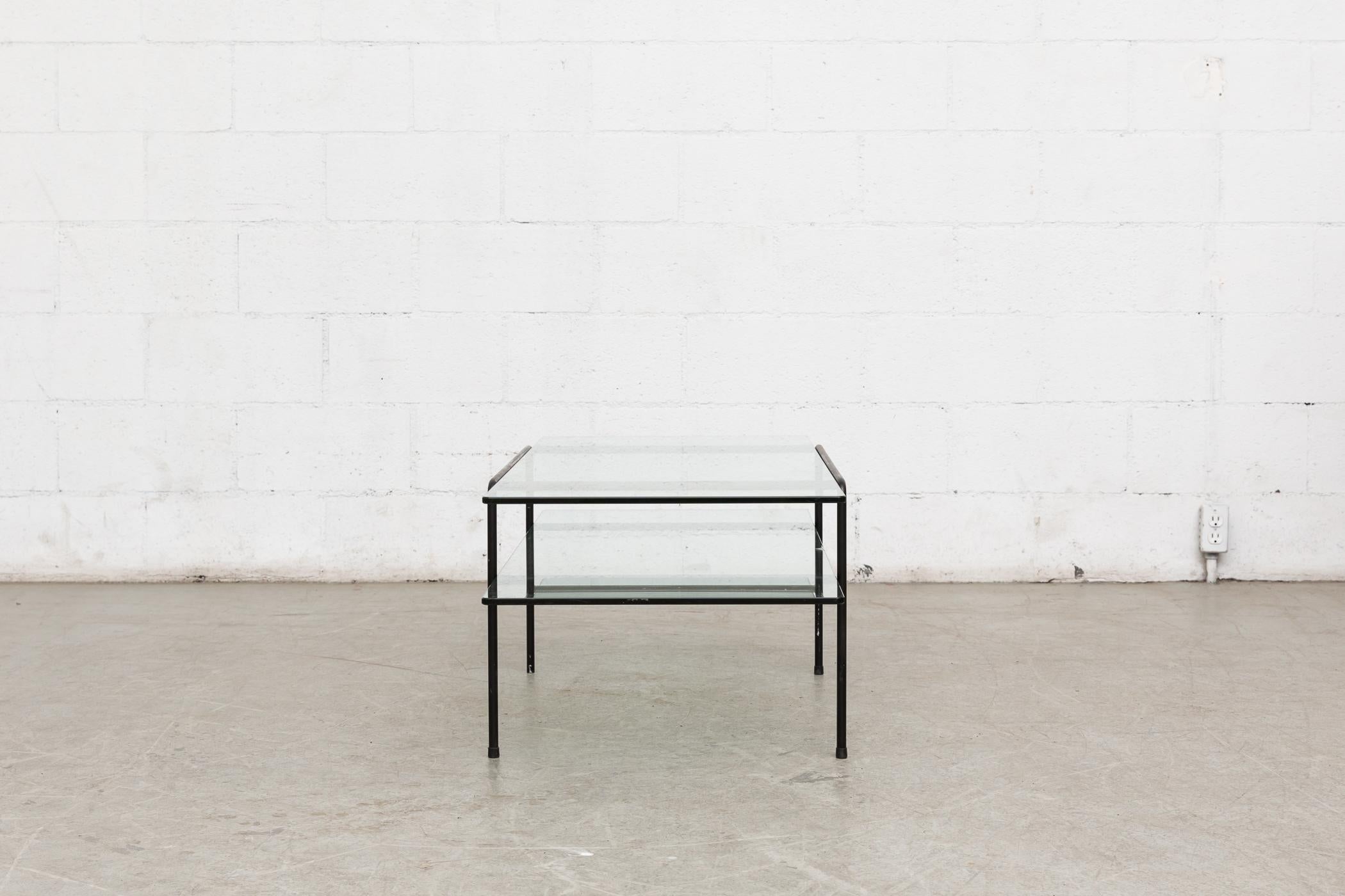 Rare Gispen two-tiered coffee table with glass tops. Black enameled metal wired frame. Designed by A.R. Cordemeyer in the Netherlands. Lower plate glass has a long oyster chip, as pictured.