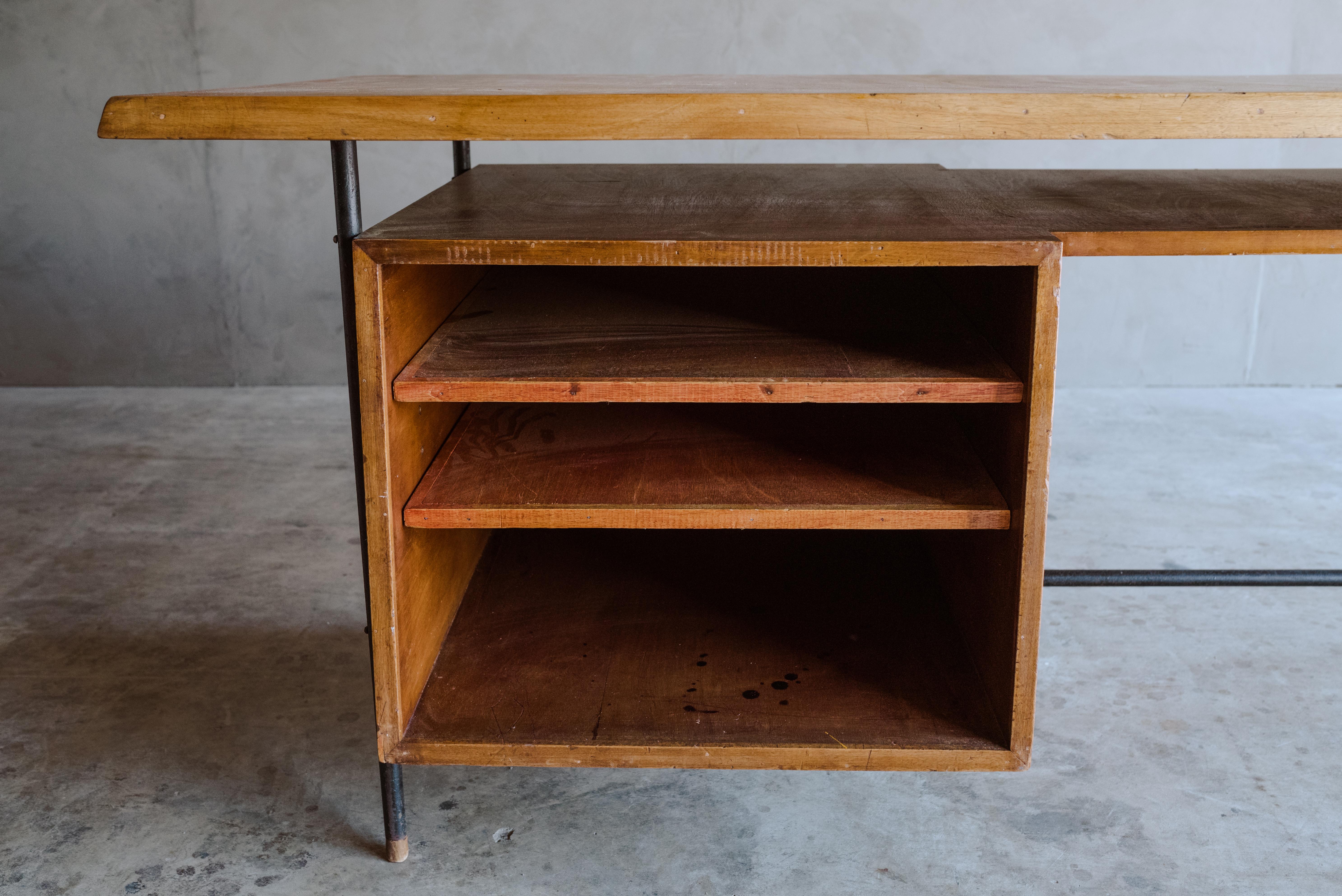 Rare architect's desk from France, circa 1960. Fantastic model with an iron frame and oak top. Adjustable shelves. Wood tips on feet.