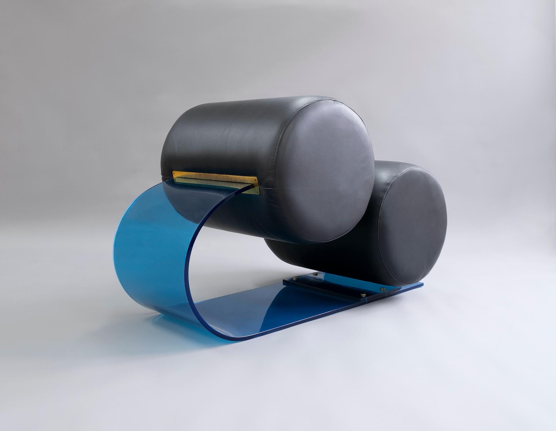 Marzio Cecchi (1940-1990)

Rare armchair sculpture built with a curved body in blue plexiglass 
and foam tubes covered with black leather making seat and backrest 
embedded in brass holders.

Only known example in blue

Italy, circa