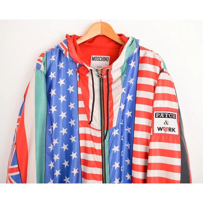 Superb, Vintage Archival Moschino 'World Flags' patterned jacket, a Piece synonymous with the UK Garage Rave scene in the 1990's, the jacket is crafted from a printed satin fabric with a draw tie hood and loose oversized fit.

MADE IN ITALY