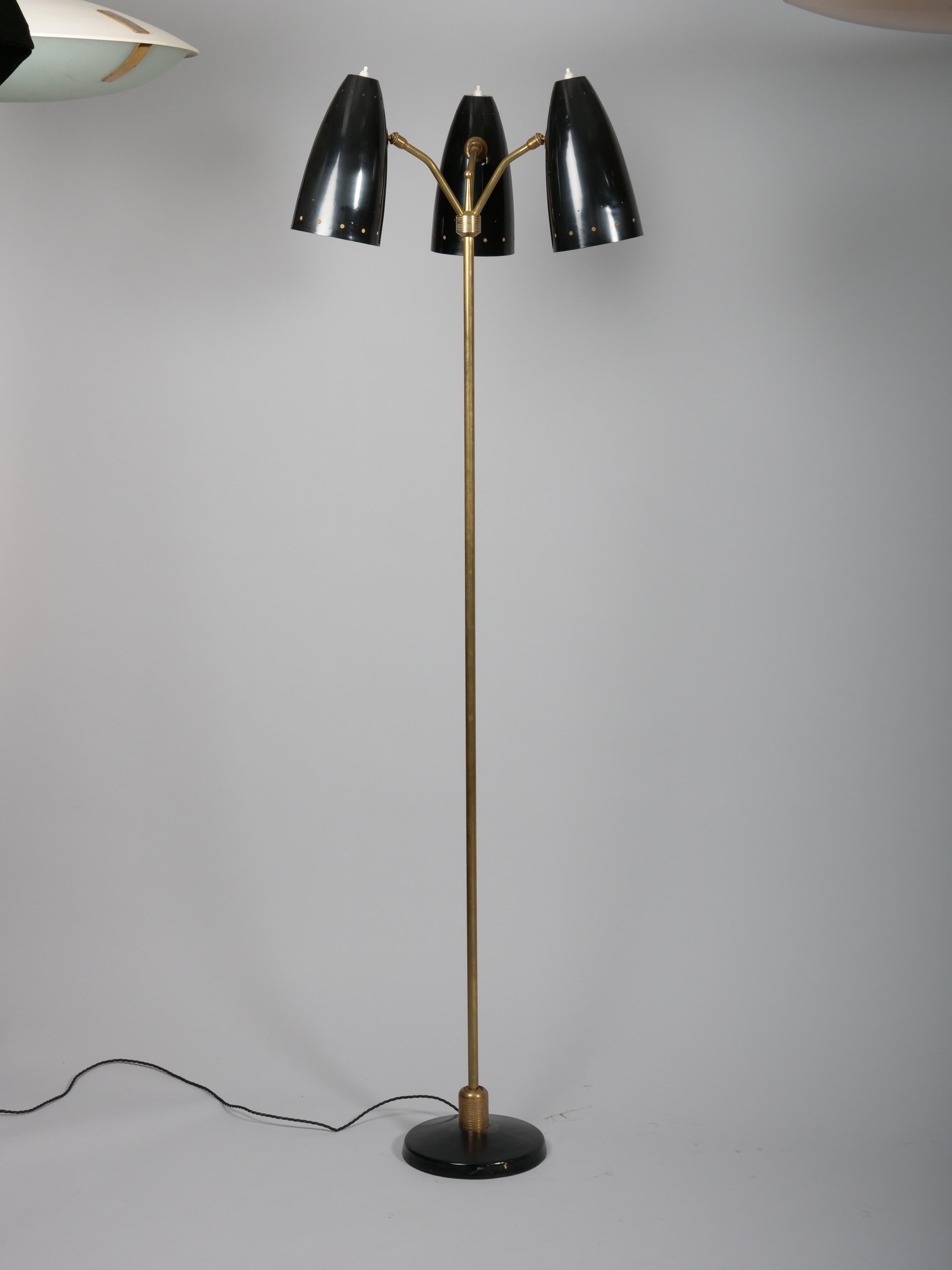 Articulated floor lamp by Maison Arlus France. C1950. 

Three shades with a switch on each.  Each shade being individually articulated. 

The light also pivots from a ball at the base allowing the whole stem to tilt 45 degrees. 