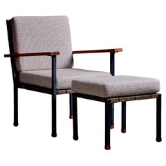 Rare Armchair and ottoman with walnut armrests, by Carl Auböck