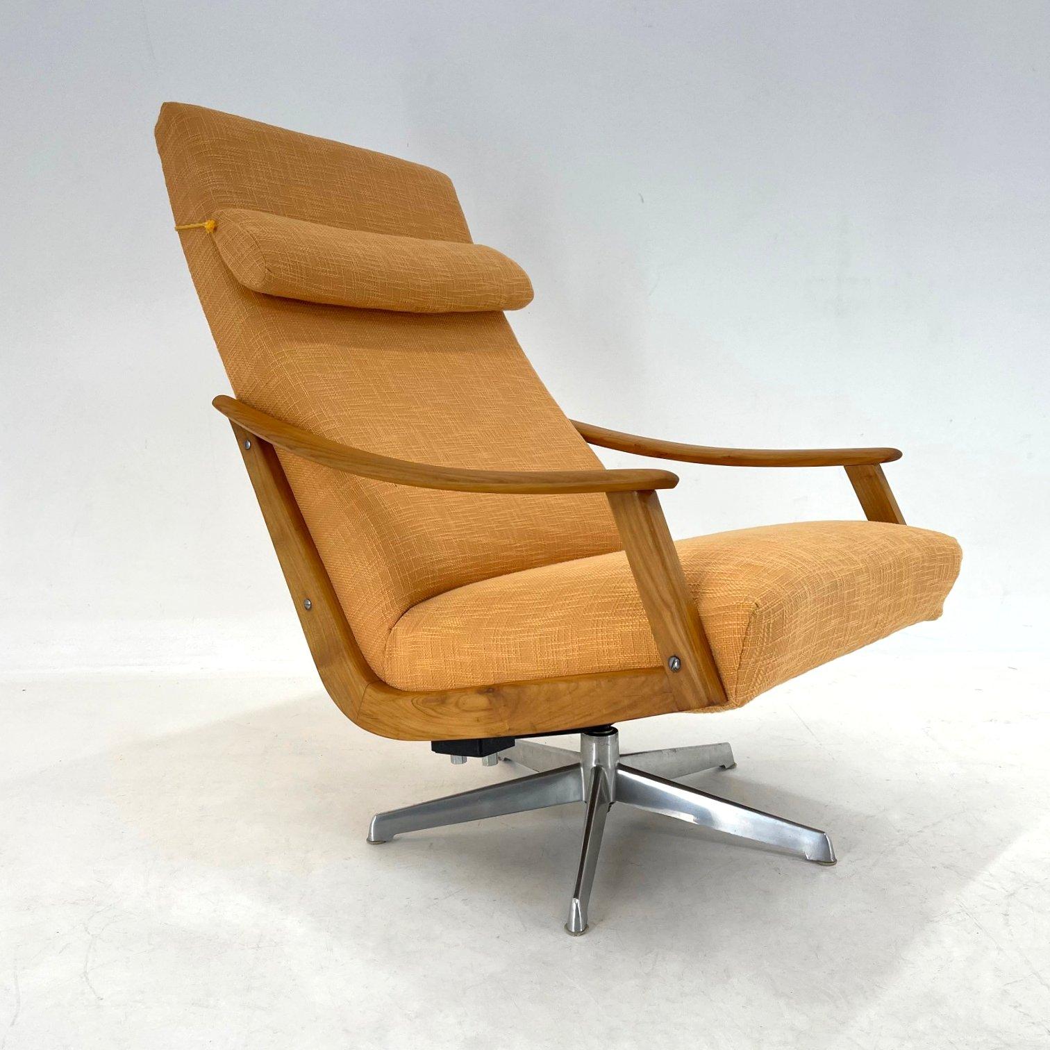 Beautiful rare, rotating armchair designed by Adolf Wrenger and produced by his company in the 1950's. The upholstery is original, in very good condition. Wooden parts were carefuly refurbished.