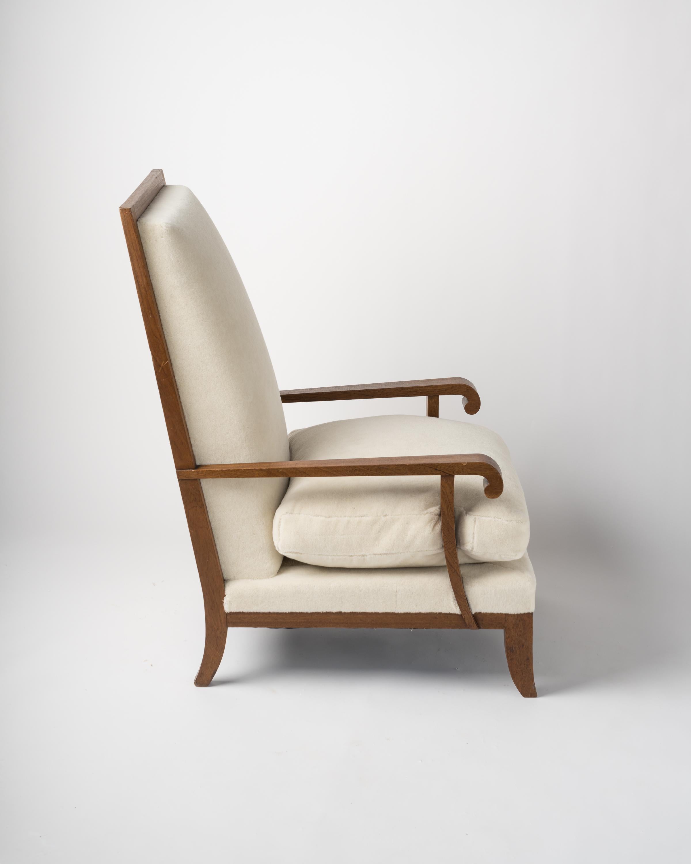 Solid oak high back armchair. Newly re-upholstered with Pierre Frey 