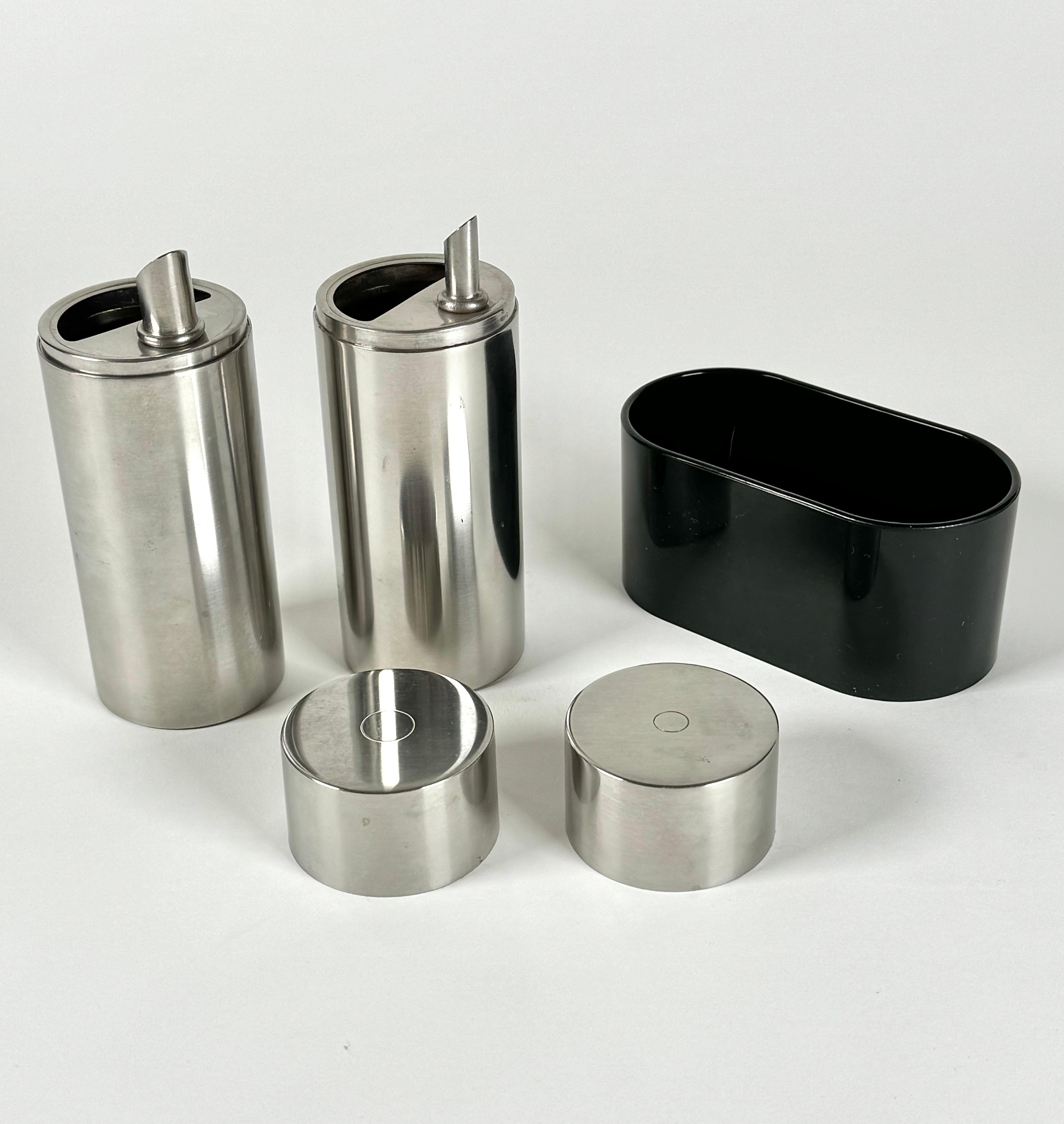 A rare and unusual set of oil and vinegar cruets designed by Danish designer Peter Holmblad for Stelton. Holmblad was the director and lead designer of Stelton, his stepfather was Arne Jacobsen and it was Holmblad who asked him to design the