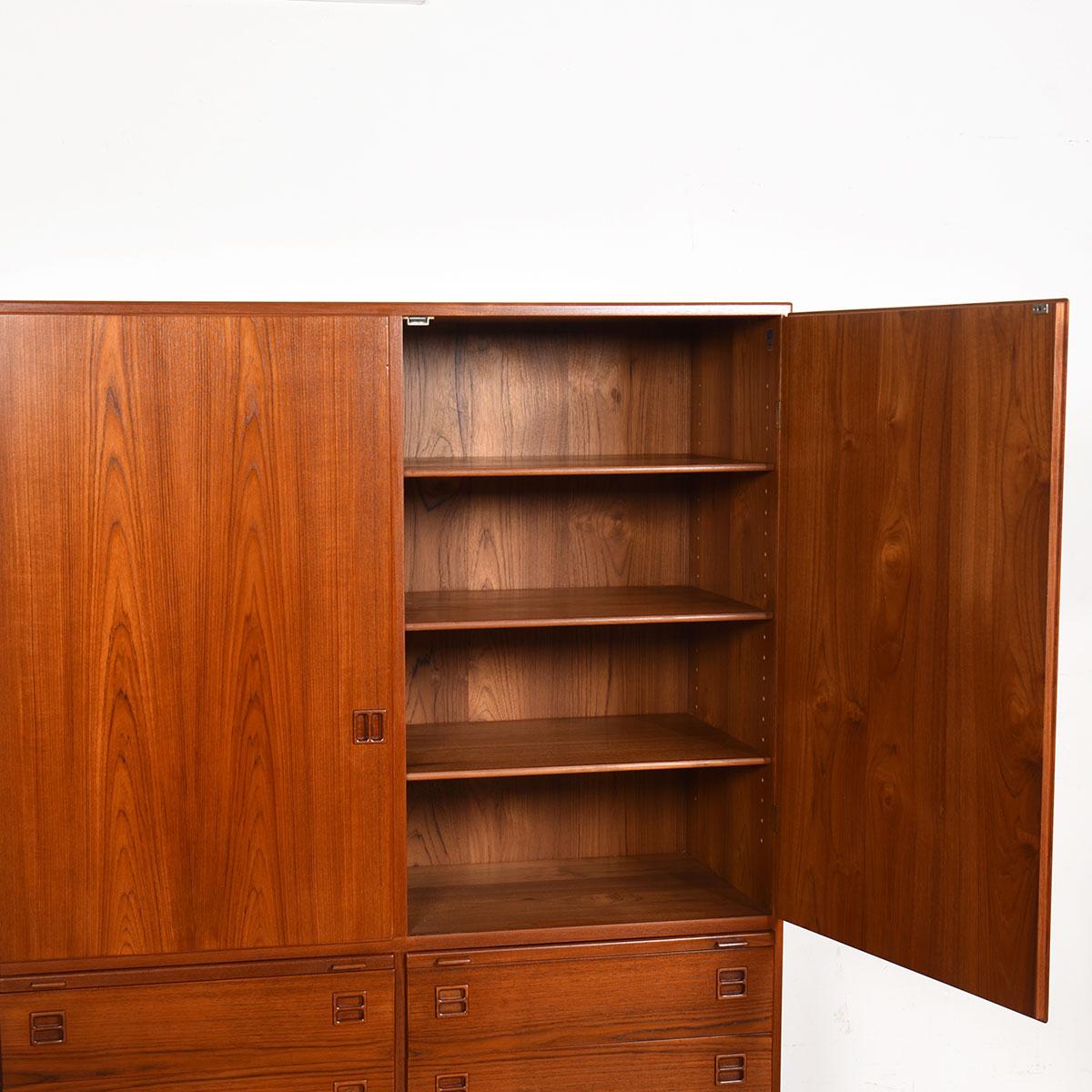 Stunning and hard to come by Danish Modern armoire designed by Arne Vodder. Plenty of storage for all of your wardrobe needs and gorgeous to behold.

Shelves in the upper portion for shirts and sweaters with small drawers for socks, intimates and