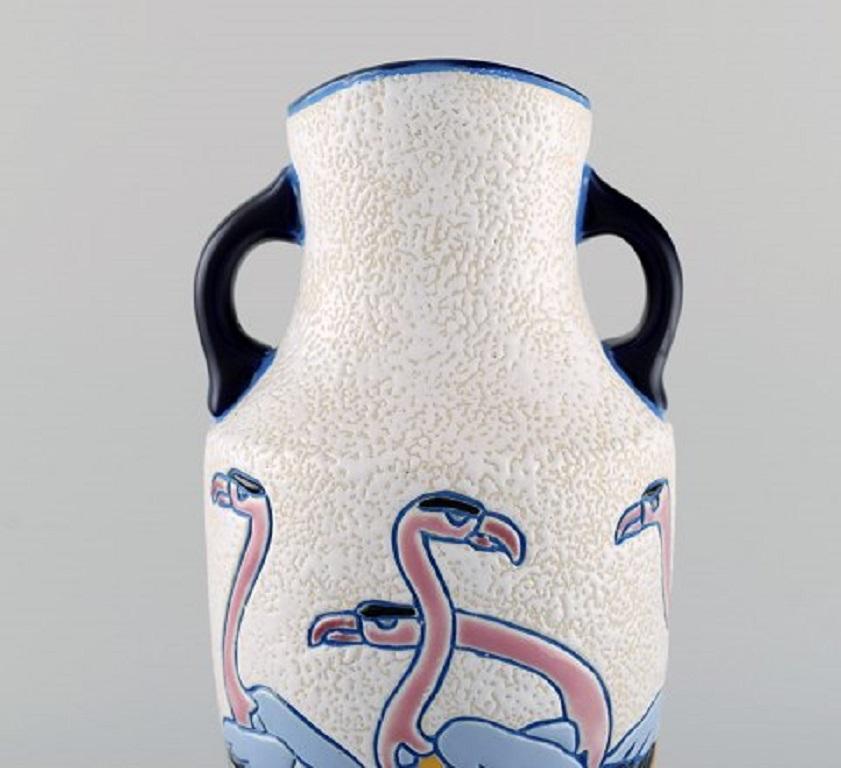 Rare Art Deco Amphora vase in glazed ceramics with flamingos, 1920s-1930s.
Measures: 31.5 x 14 cm.
In very good condition.
Stamped.