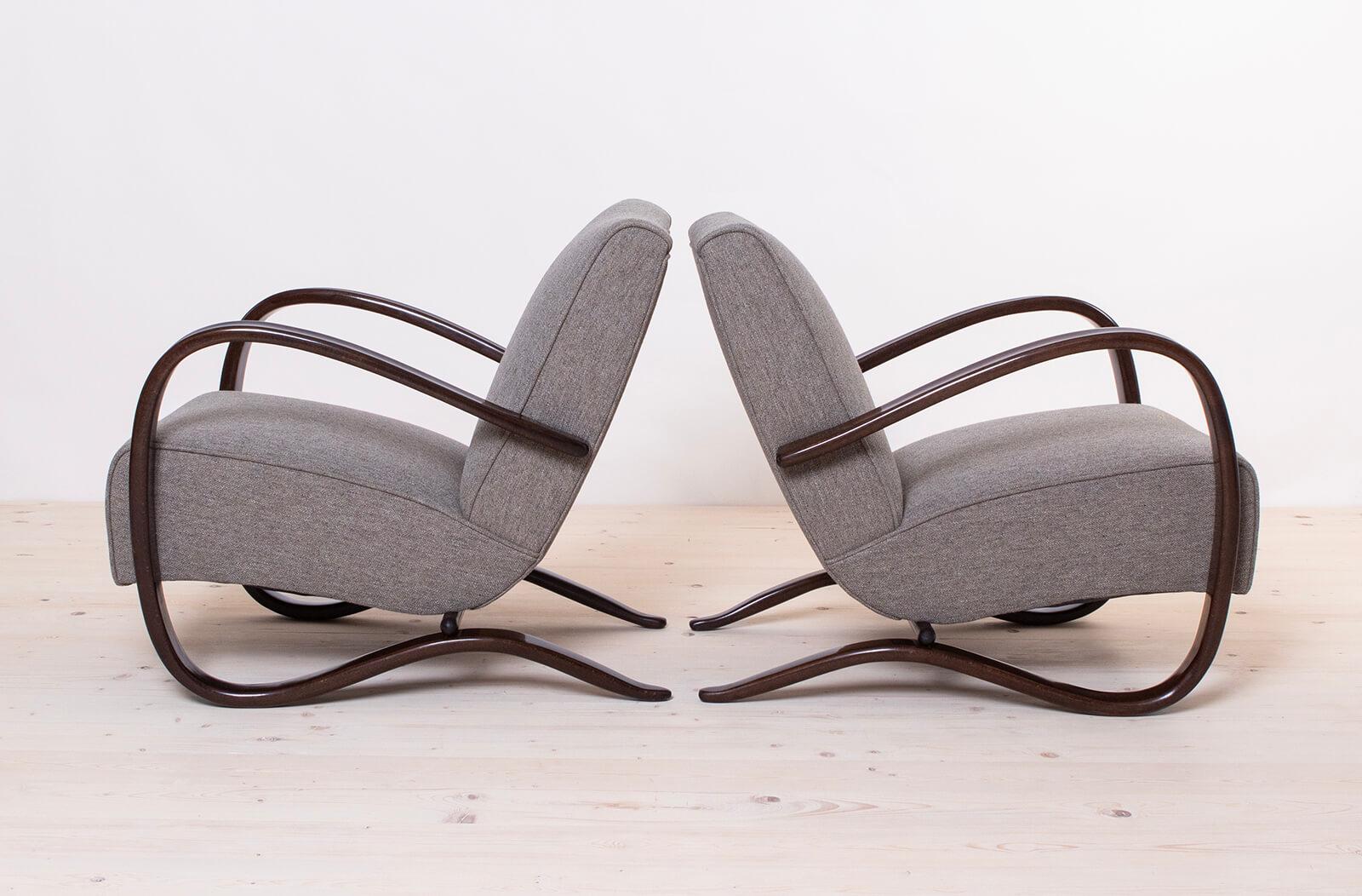 Set of two Art Deco armchairs designed by famous Jindrich Halabala in 1930s in Czechoslovakia. One of his iconic models, H269. The armchairs have been professionally restored, reupholstered in high quality fabric from Danish brand KVADRAT and all