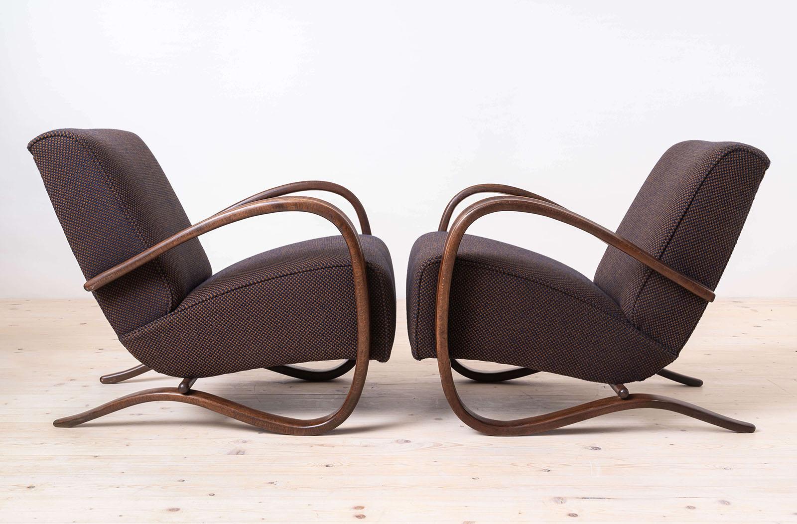 Set of two Art Deco armchairs designed by famous Jindrich Halabala in 1930s in Czechoslovakia. One of his iconic models, H269. The armchairs have been professionally restored, reupholstered and all the foam and internal upholstery has been replaced,