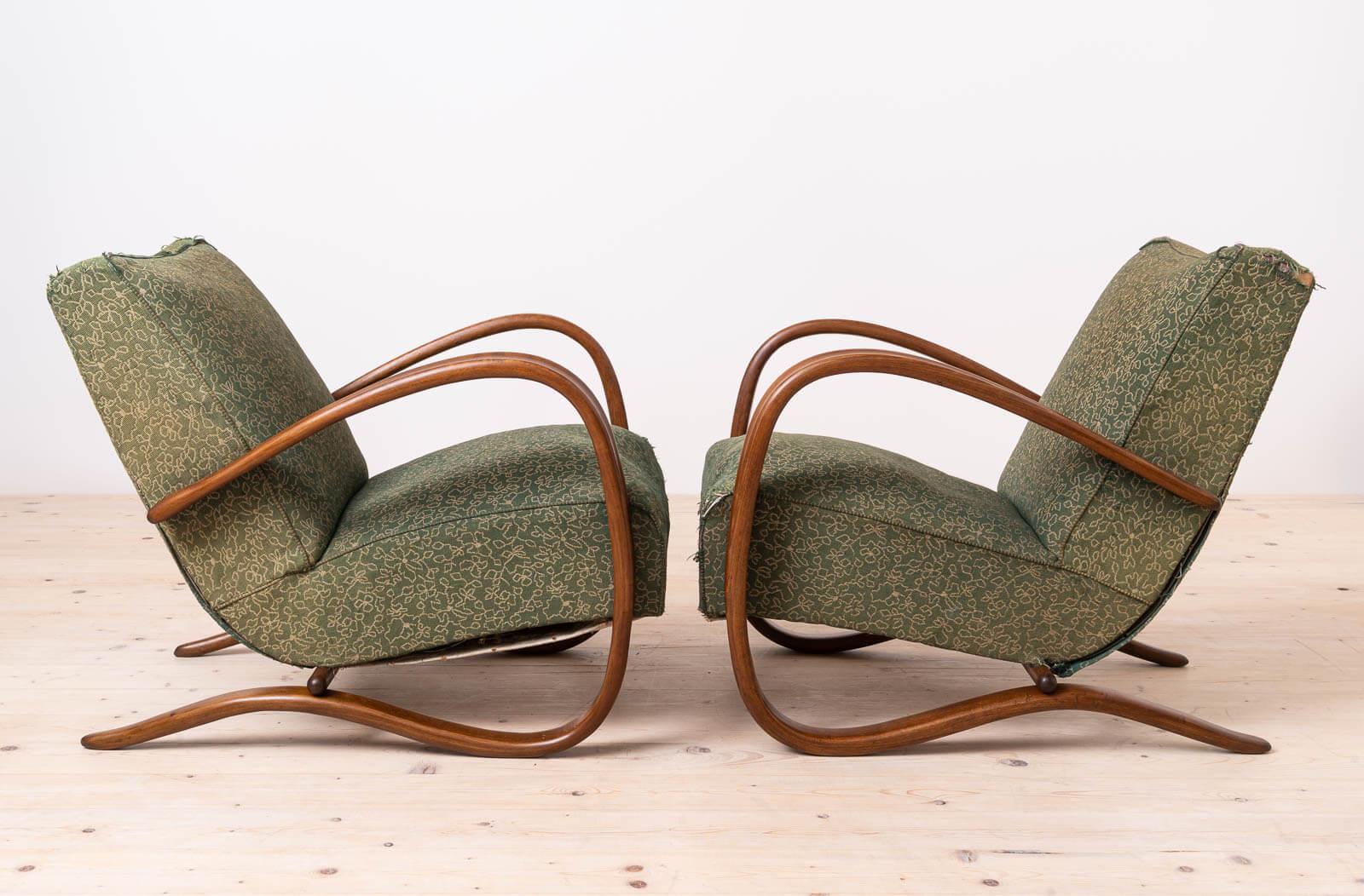 Set of two Art Deco armchairs designed by famous Jindrich Halabala in 1930s in Czechoslovakia. One of his iconic models, H269. The wooden elements have been professionally restored. The wooden elements have been cleaned and refinished with wax that