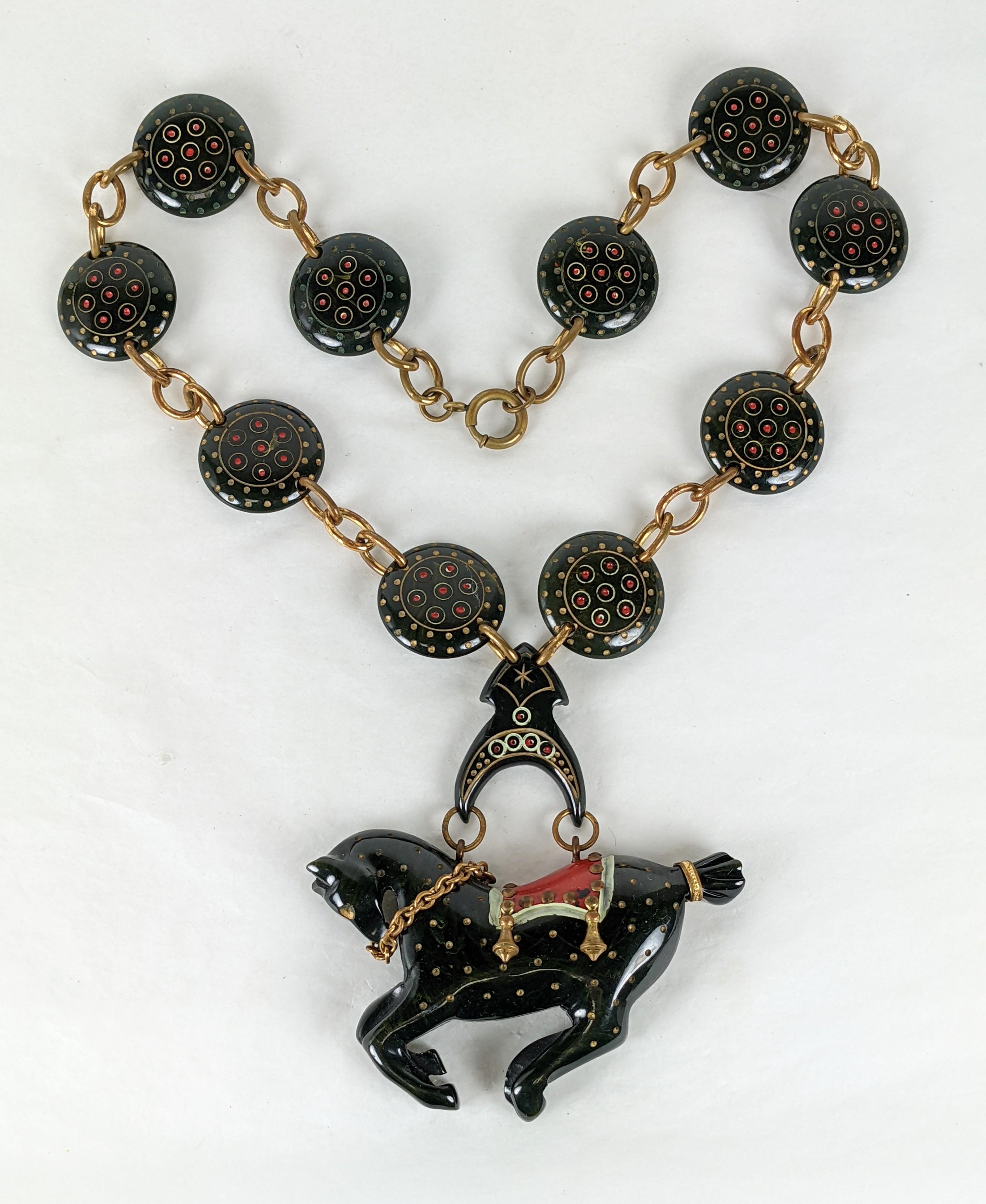 Incredibly Rare Bakelite Carousel Horse Necklace from the 1930's Art Deco period. On occasion the carousel horse motif is seen on a cuff but this necklace is possibly a one of a kind piece of American Folk Art. The scale is incredible as is the
