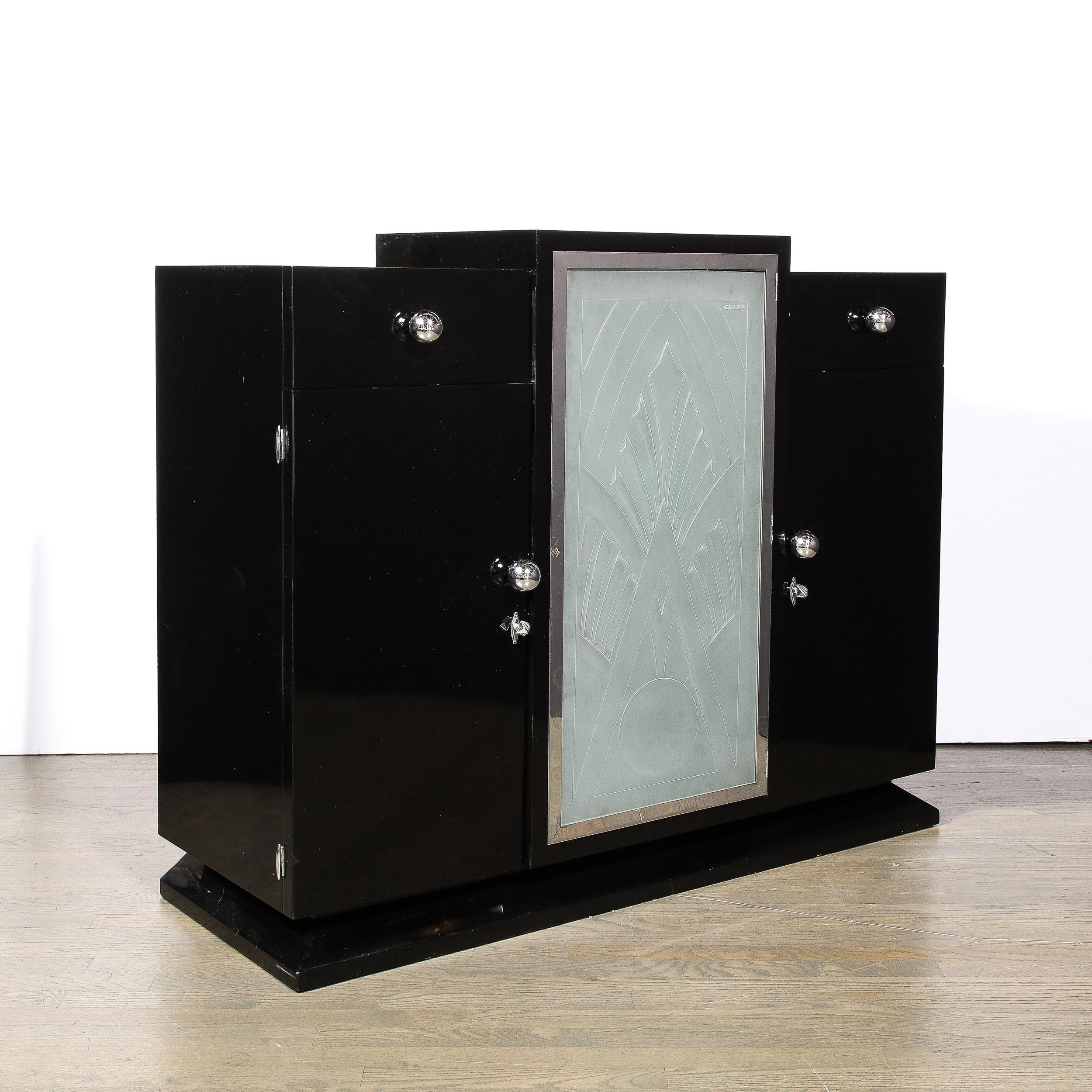 -This Stunning Art Deco Cabinet in Black Lacquer and relief Frosted Glass is created by the esteemed designer and metalworker Pierre Gilles and originates from France, Circa 1935. Featuring a beautiful front panel in molded and frosted glass