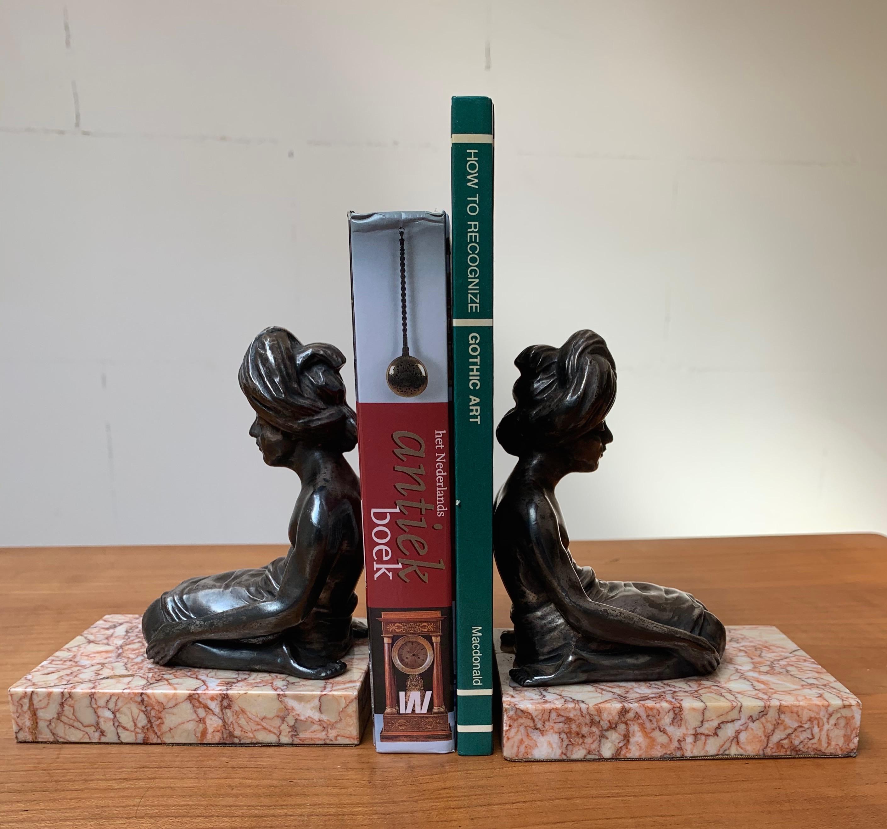 Unique on 1stdibs and possibly worldwide.

It was in the early 20th century that meditation became known in Western society. Like many artists, the one who handcrafted the sculptures that were used to create these bookends probably traveled through