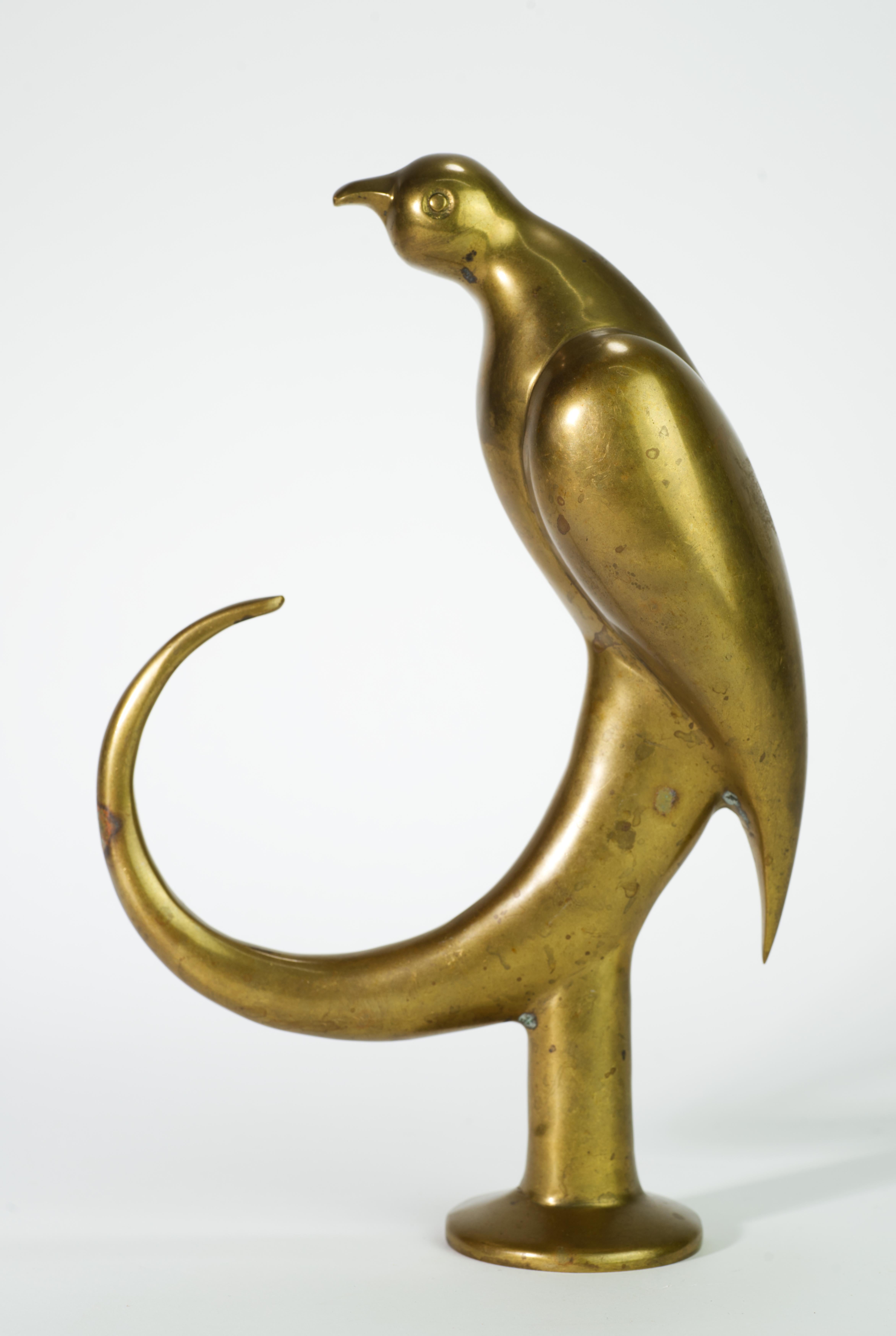  Rare and unusual Art Deco style figurine of perched bird has classic streamlined design and minimal, but expressive detailing.

This piece is attributed to Dolbi Cashier by comparing it with signed figurines in online auctions and catalogues; the