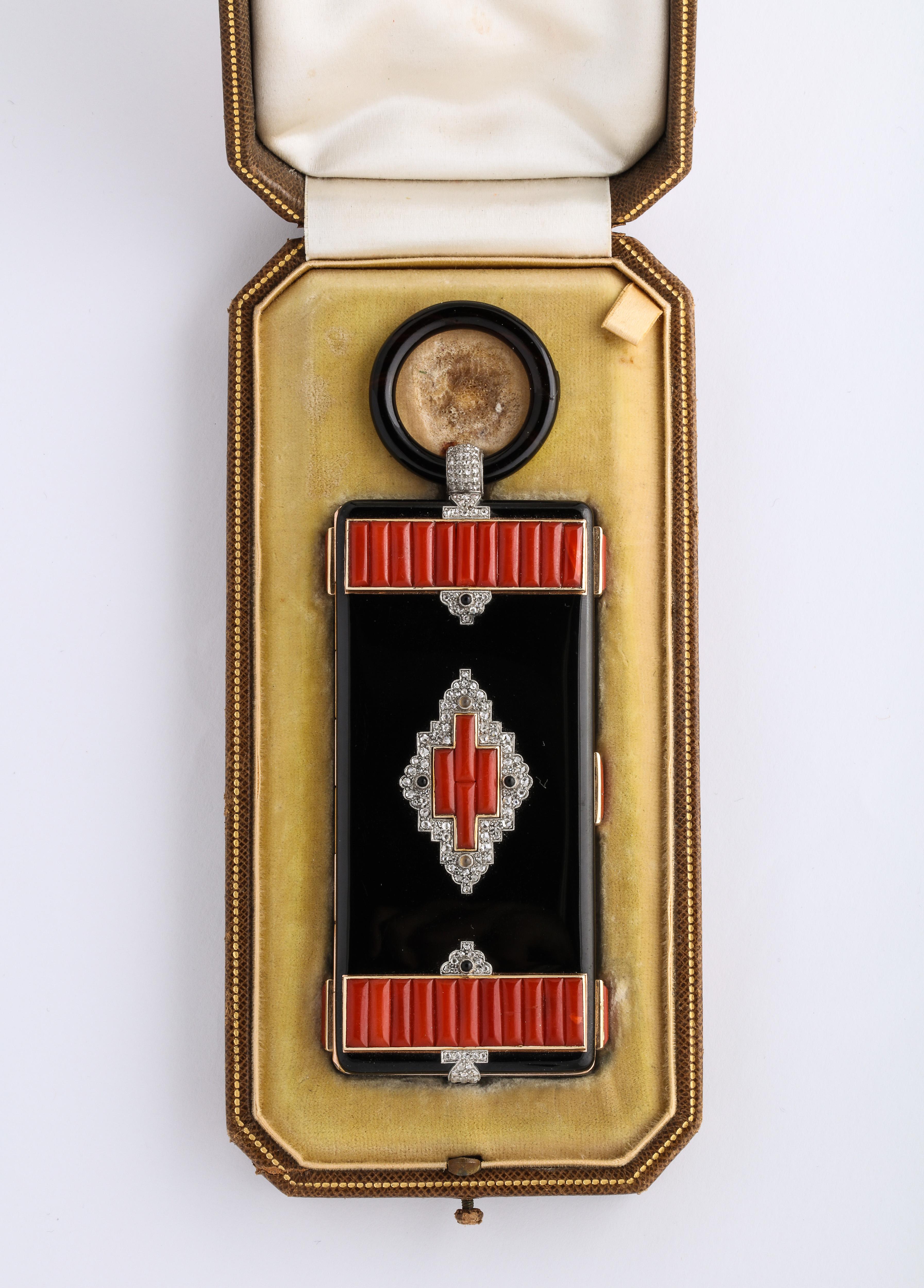 Rare 1930's Original Art Deco Cartier Vanity Case w/ original Fitted Box.
Appears to have never been used, adorned with black enamel, Diamonds and beautifully carved coral, with an Onyx loop.

Very Attractive and presentable!

total weight 177