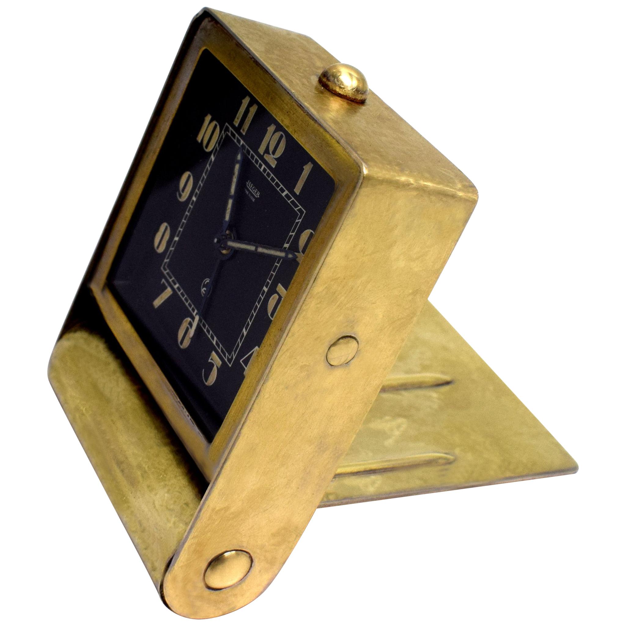 This is for a beautiful original and extremely stylish Art Deco desktop alarm clock made by Jaeger LeCoultre. It dates to the 1930s, it has a 30 hour movement and it has a gold toned scumbled effect metal casing with a back dial face and stylised