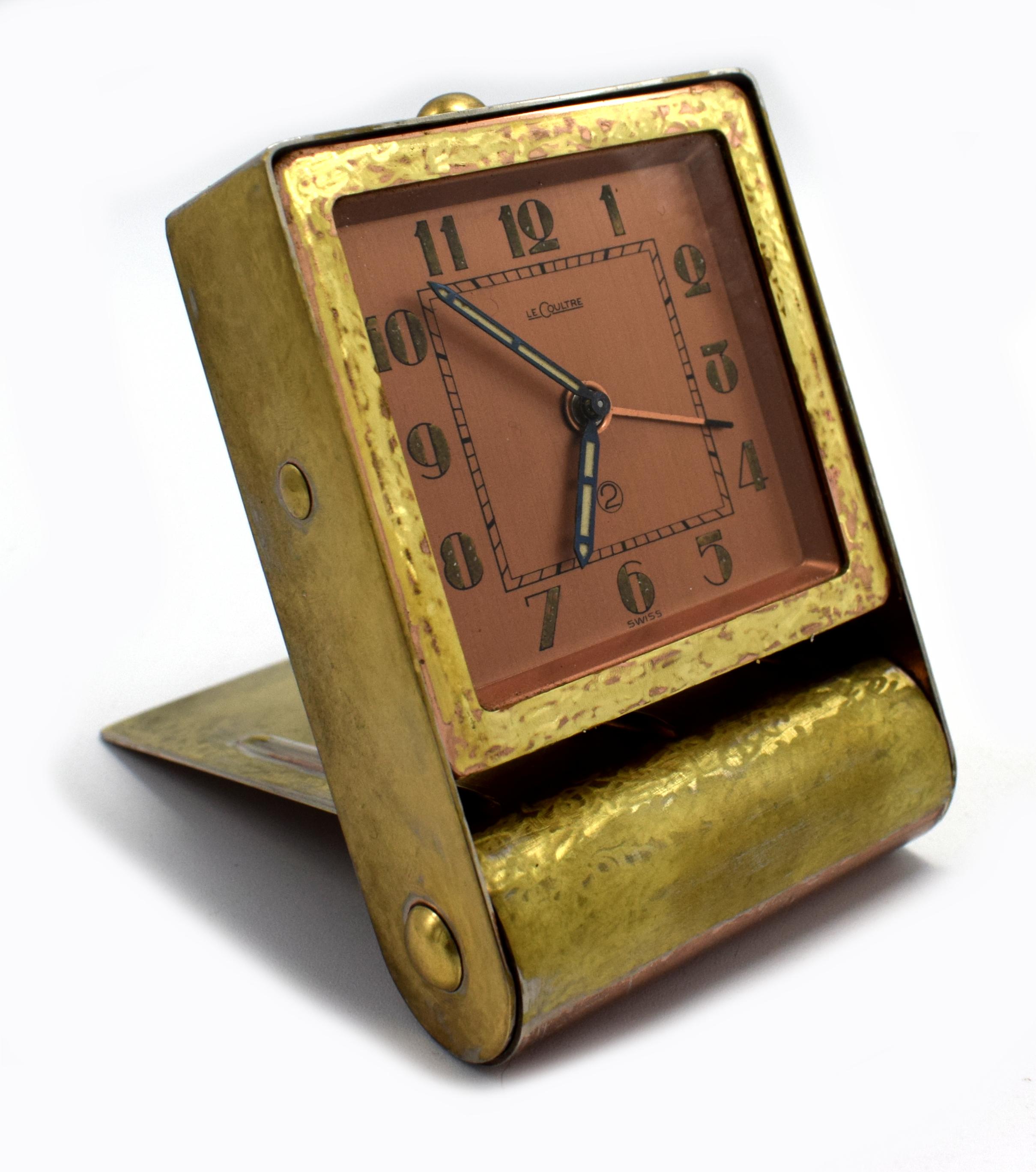 This is for a beautiful original and extremely stylish Art Deco desktop alarm clock made by Jaeger LeCoultre. It dates to the 1930s, it has a 30 hour movement and it has a gold toned scumbled effect metal casing with a copper coloured dial face and