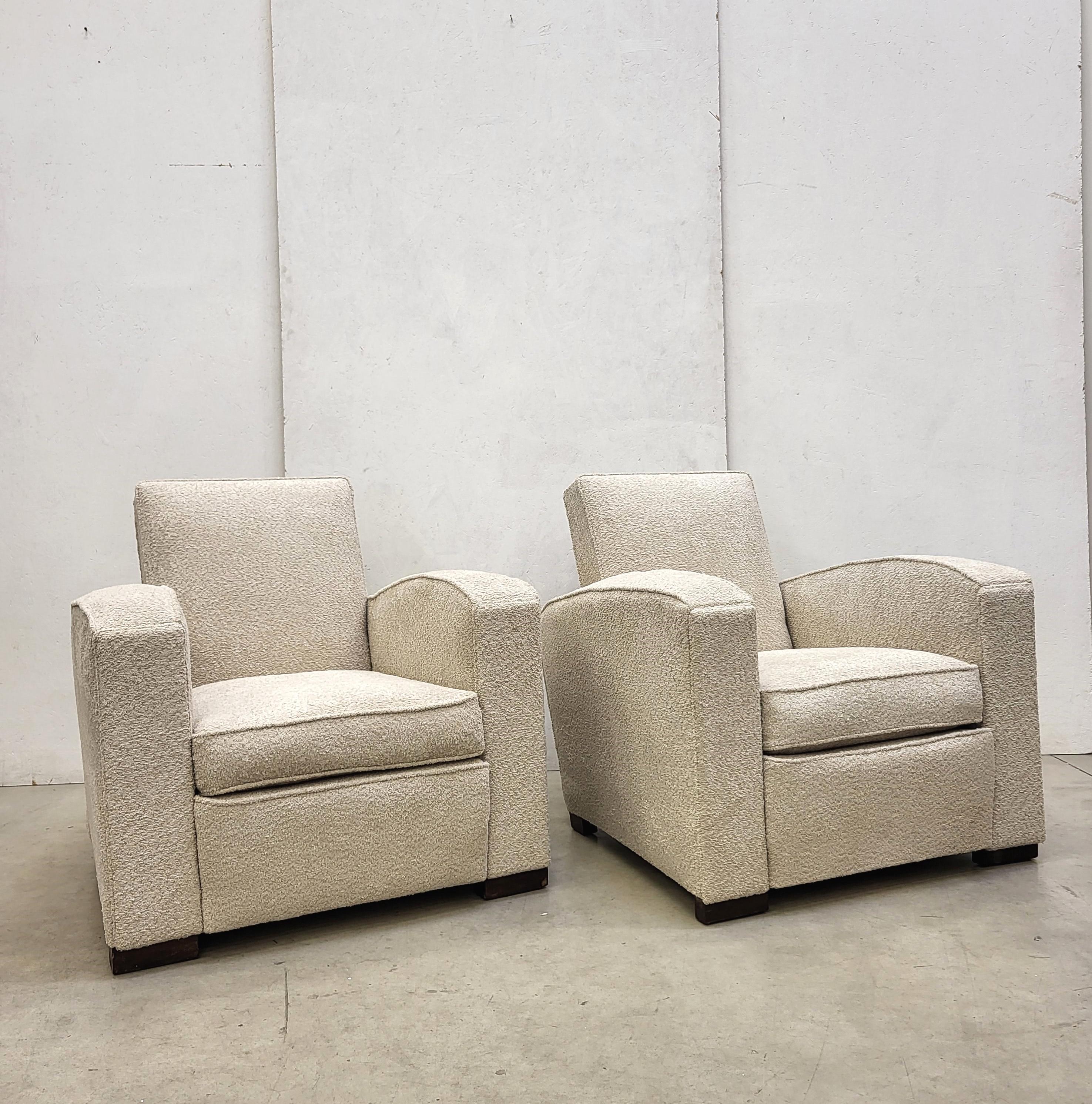 Very rare and fine armchairs by Jacques Adnet. Made in France in the early 1930s.
Fine Bouclé upholstery. Feets are made by solid wood.

Stunning pieces. The chairs are in excellent, restored condition.

We are able to ship the chairs worldwide,
