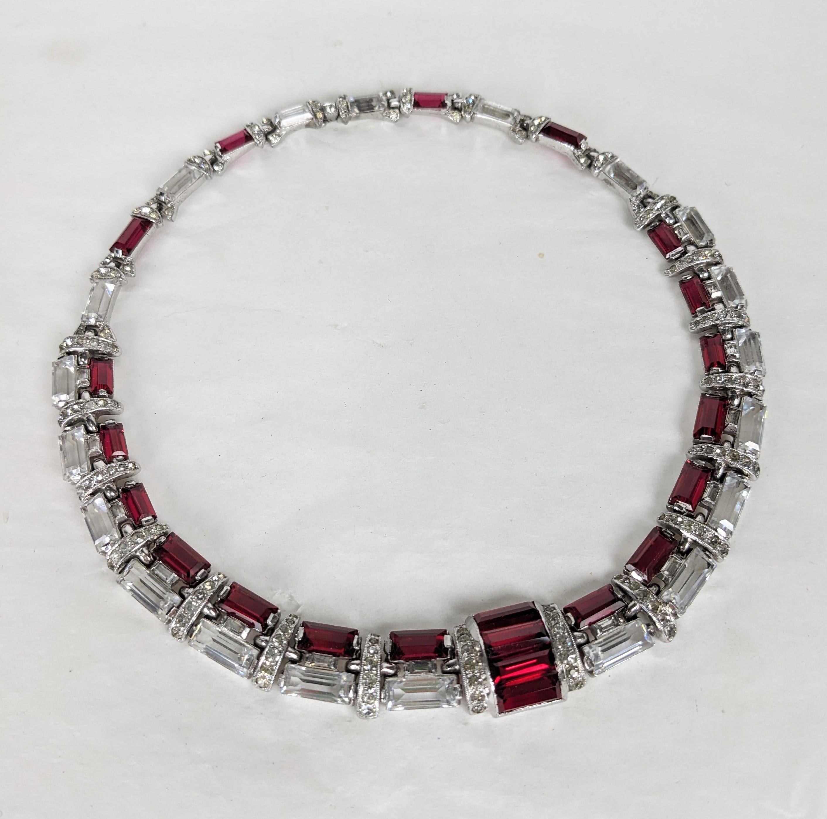 Rare and unusual Art Deco DeRosa Crystal Baguette Collar of crystal and faux ruby baguettes set into stepped design within articulated pave links. High Art Deco rhodium metal setting. Unsigned DeRosa. 
1930's USA. Length 15.5