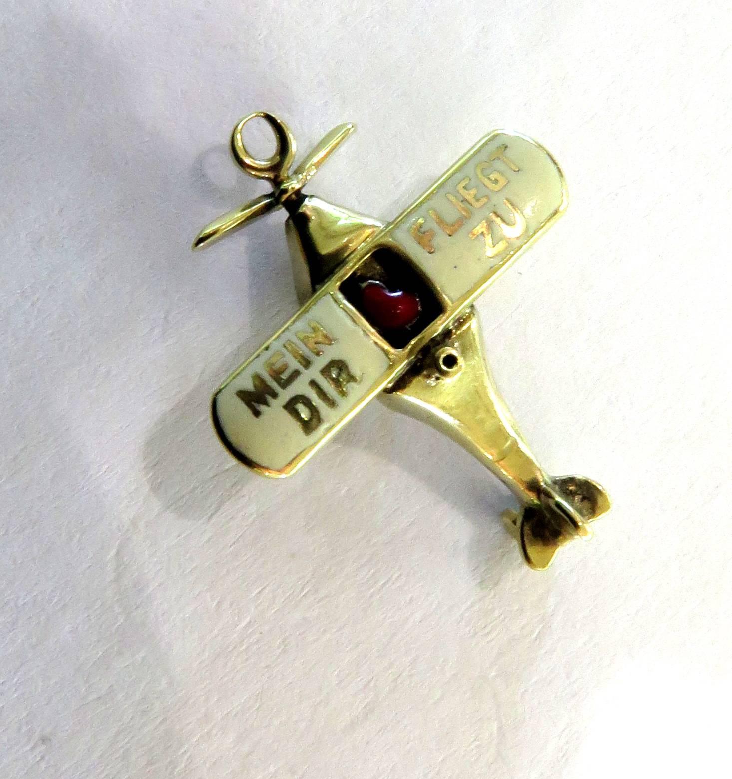 This romantic 14k airplane charm is just incredible! The enamel on the wings in German say 