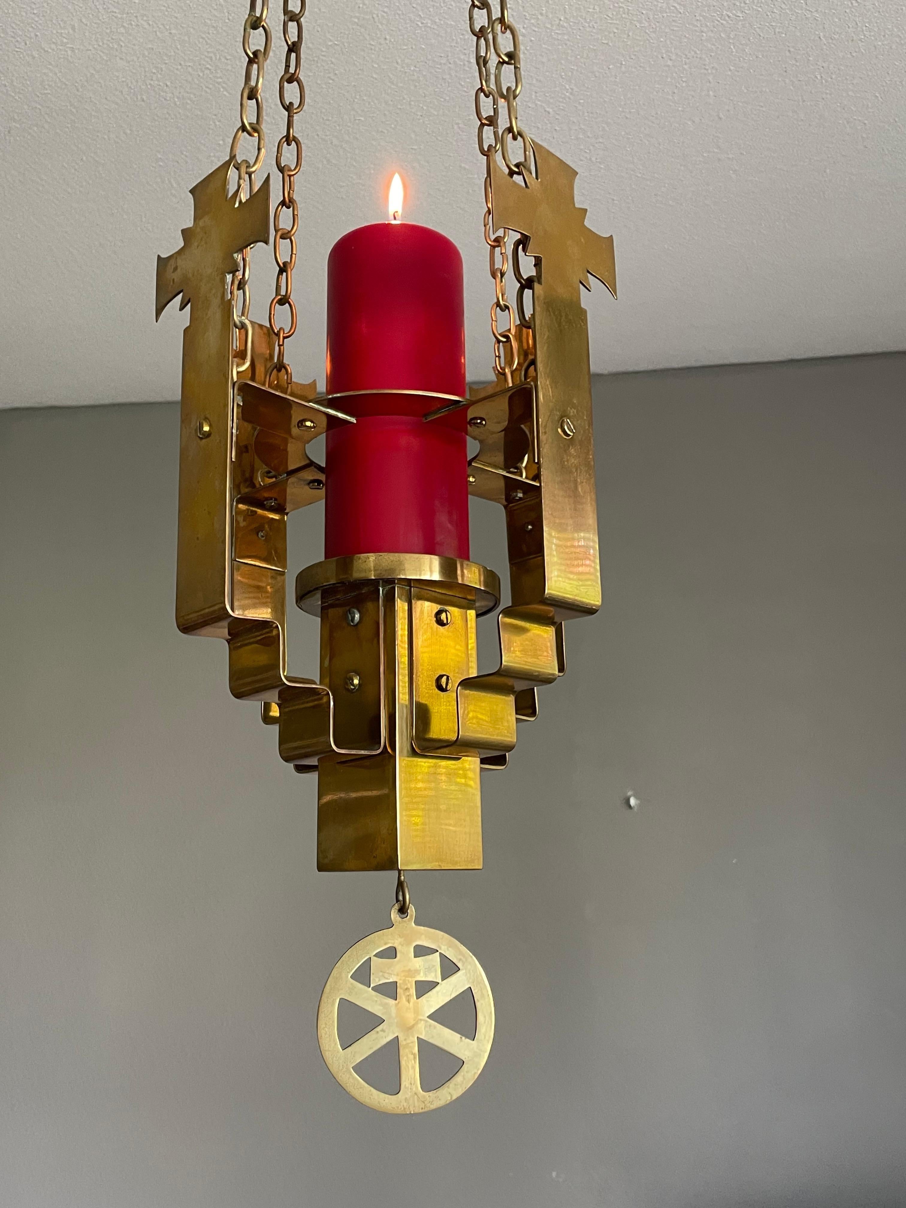 Beautiful and meaningful work of religious art for a serene atmosphere.

This practical size and compact church candle chandelier is perfect for creating a spiritual atmosphere. All handcrafted in the Art Deco era one can immediately recognize the