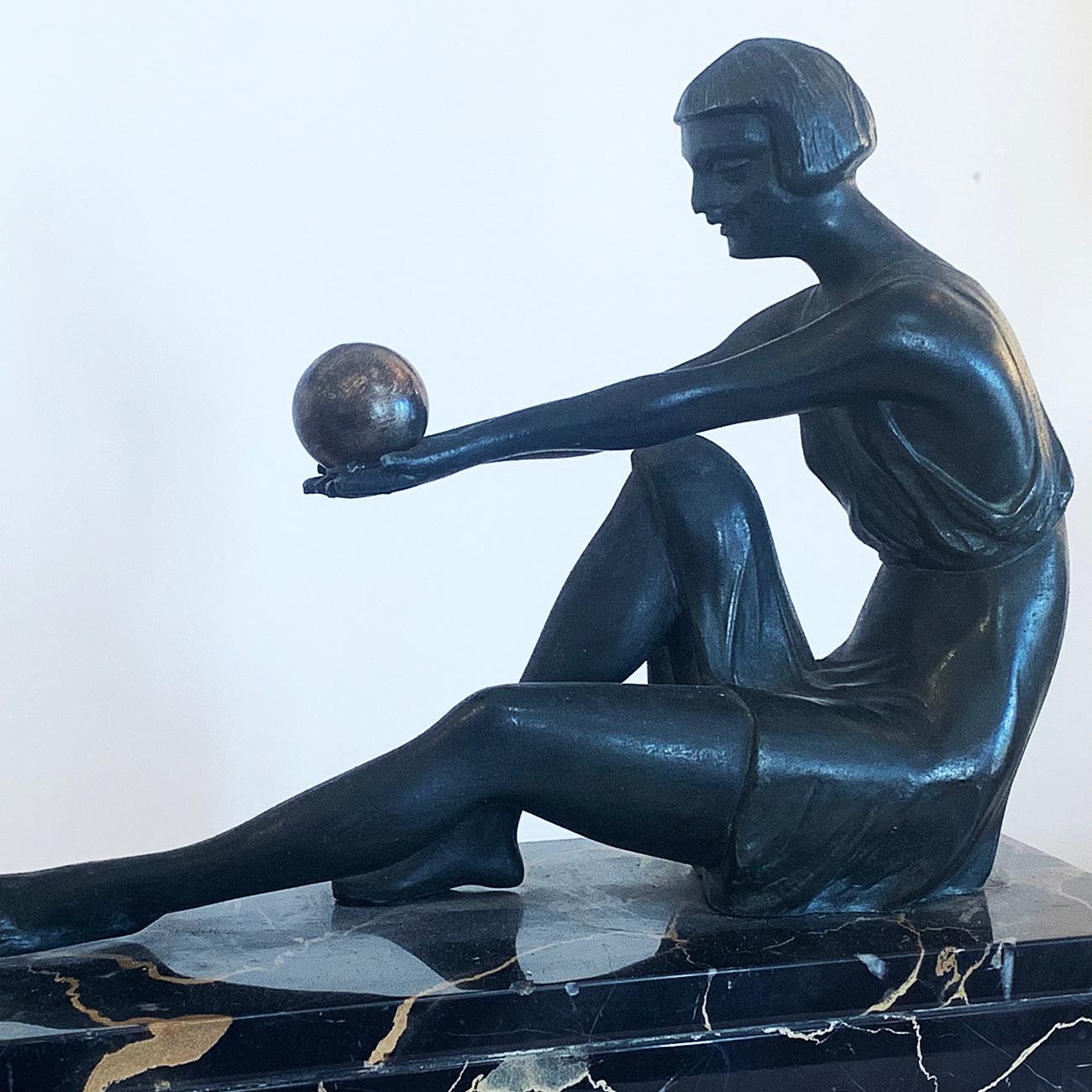 Art Deco French Lamp, with bronze Ladies offering “Gilt, Bronze Spheres towards the light”, with the glass decorated in the traditional French carved Roses pattern around base. The lower marble is all Italian Potoro Marble in Black with white and