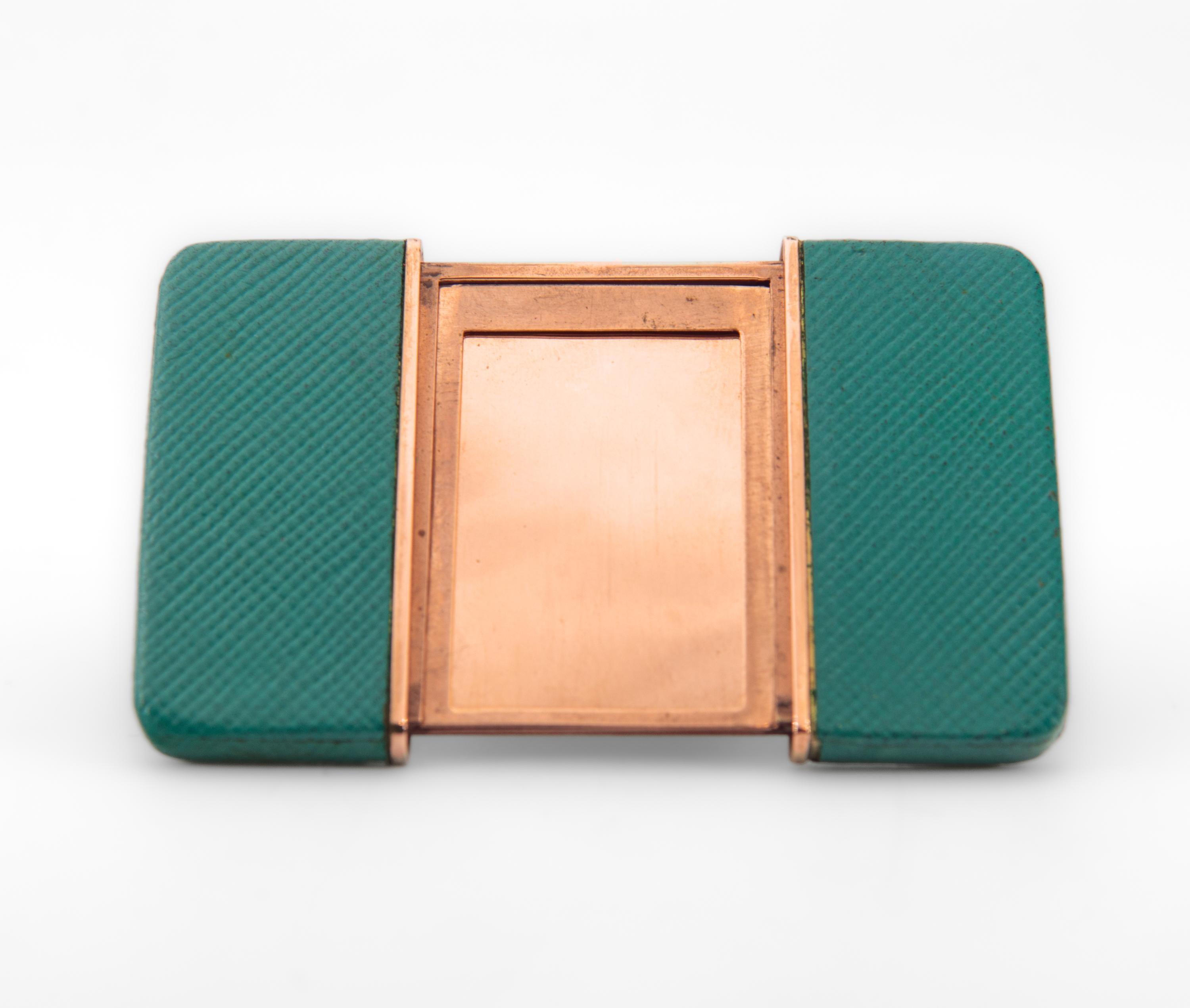 A rare Art Deco period miniature travel leather and rose gold toned picture frame. Stamped: S.T. Dupont Paris. Made in France. Circa 1930.

The picture frame has a pull-out action with easel back. The leather is in a wonderful sea green colour, a