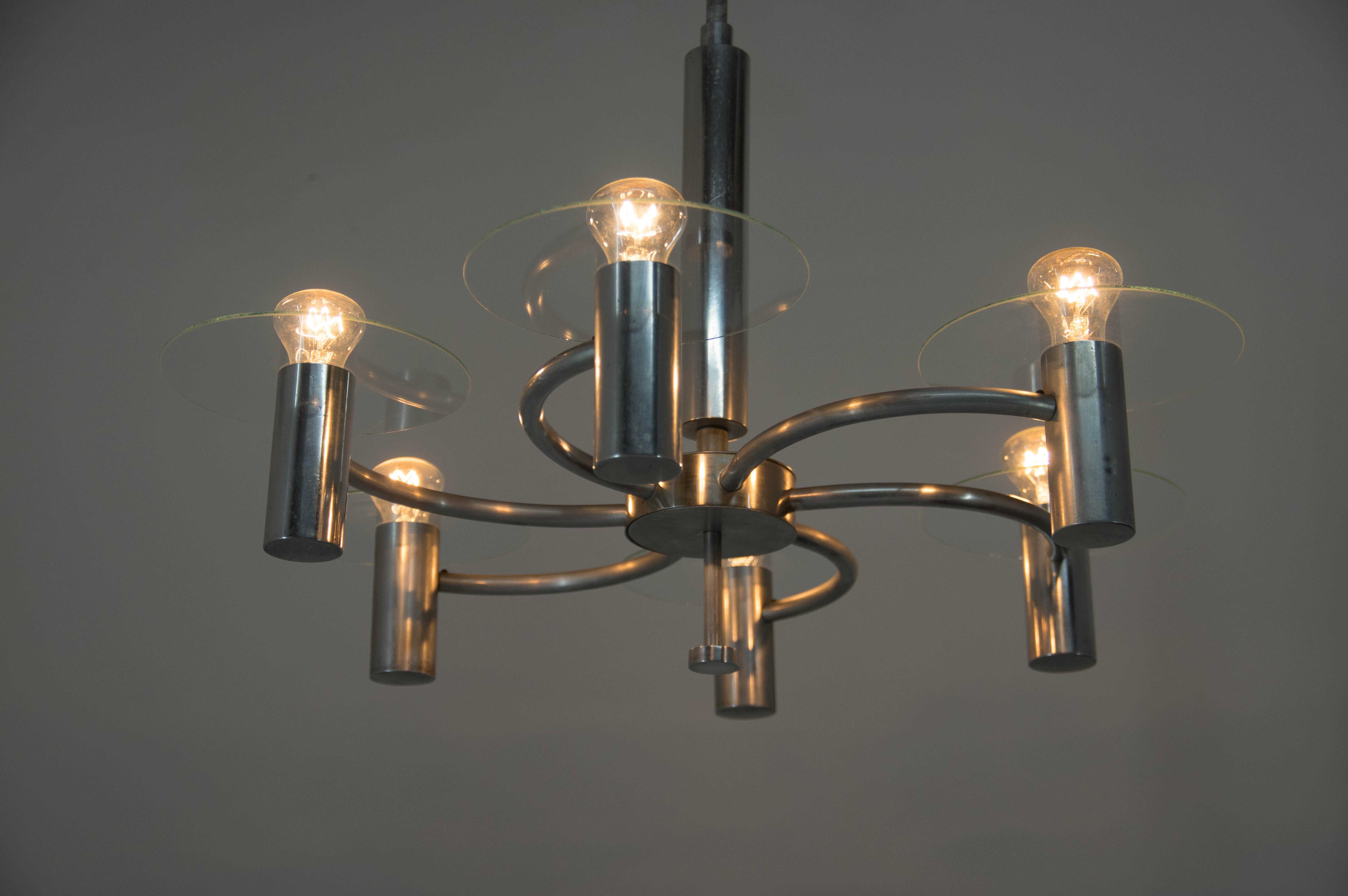 Rare Machine Age chandelier influenced by aircraft propeller.
Polished and rewired: two separate circuits - 3+3x60W, E25-E27 bulbs
Minor loses on the inner hole of the glass shades are not visible when assembled.