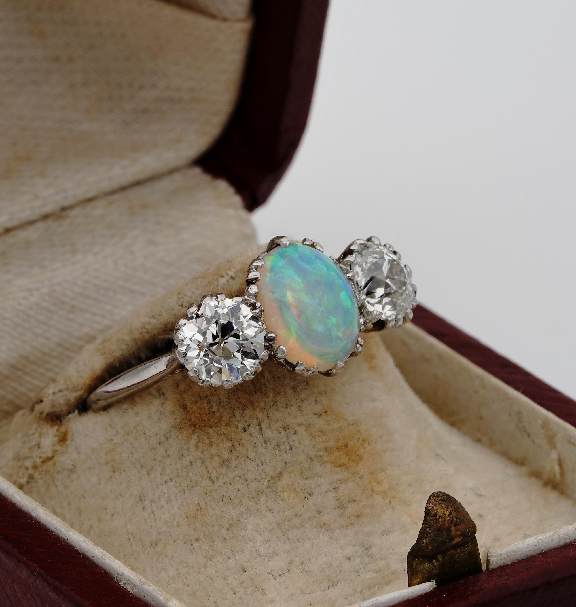 Magnificent Three Stone

Spectacular example of Art Deco Diamond and natural Opal three stone ring
Suitable for engagement, anniversary, or for beauty lovers
Authentic 1920 ca, entirely hand crafted of solid Platinum with exquisite mount in the