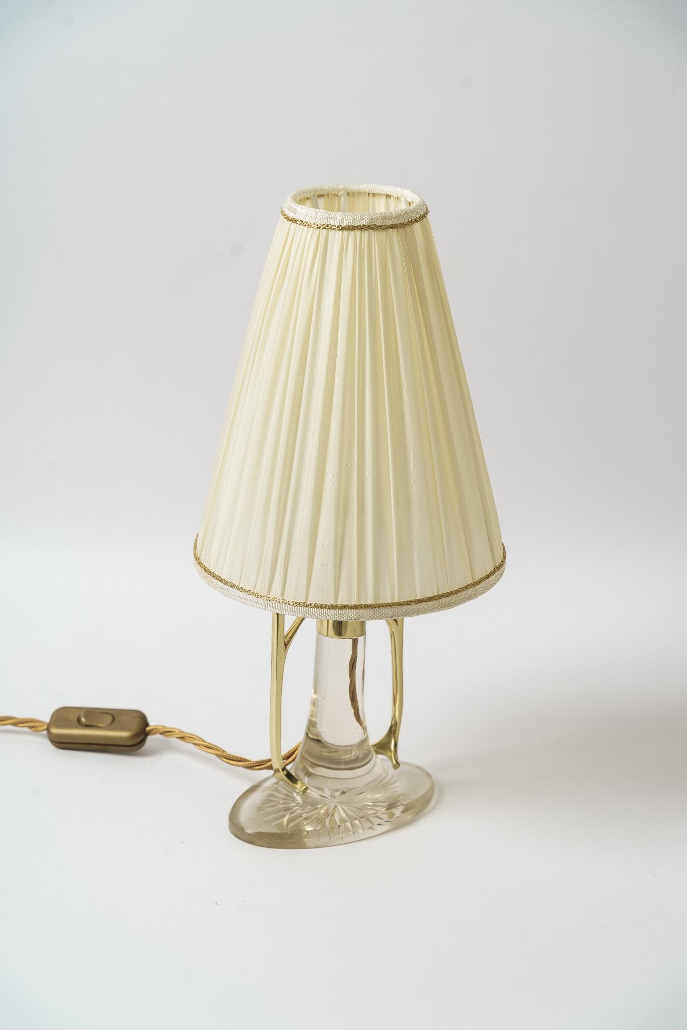 Rare art deco glass table lamp with fabric shade vienna around 1920s
Brass polished and stove enameled
The fabric shade is replaced.