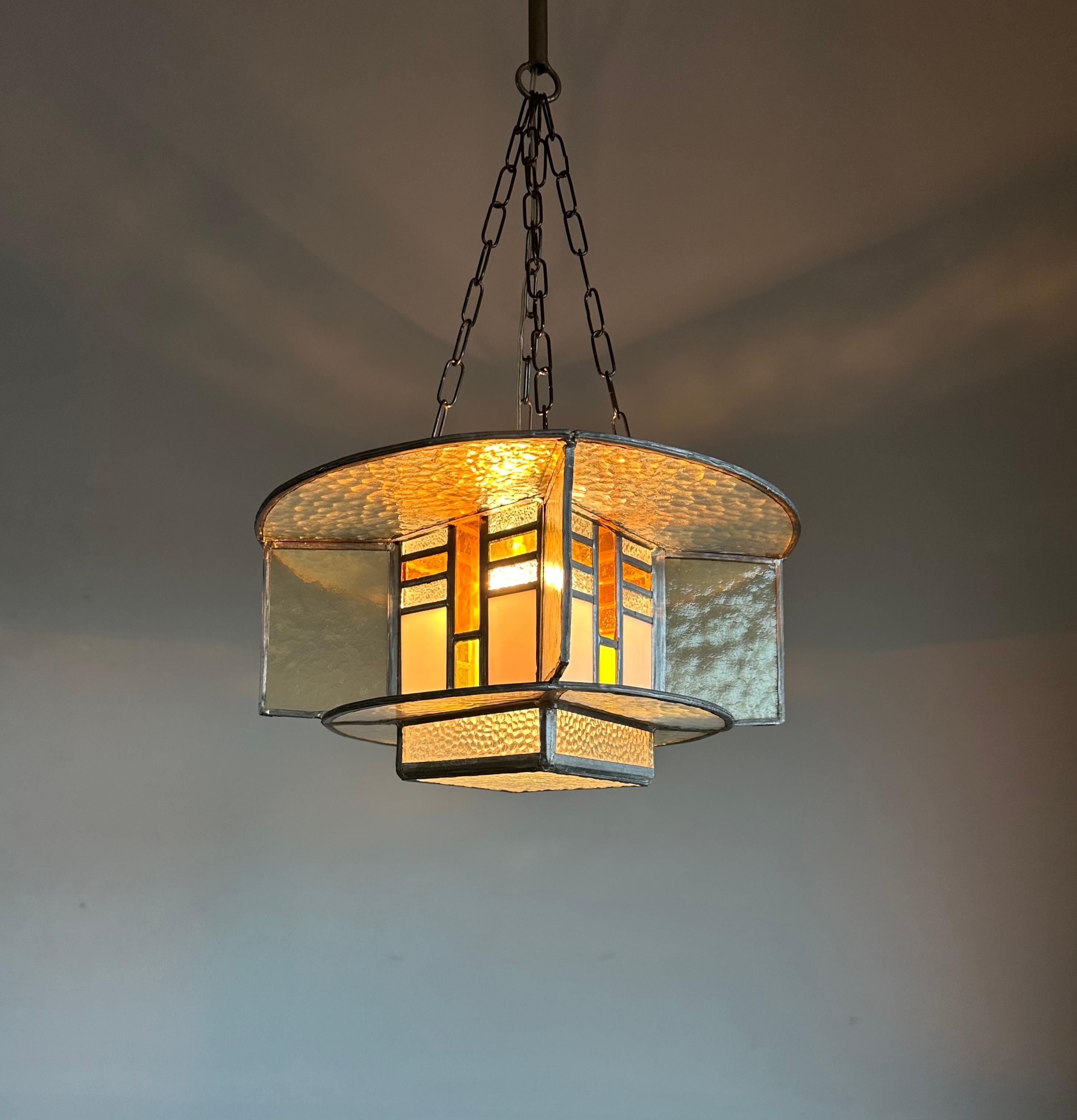 Wonderful looking and very rare design Art Deco stained glass pendant.

Finding antiques that we have never seen before is one of the things that we love most in life. One family has been enjoying this unique light fixture for the past 30 years and