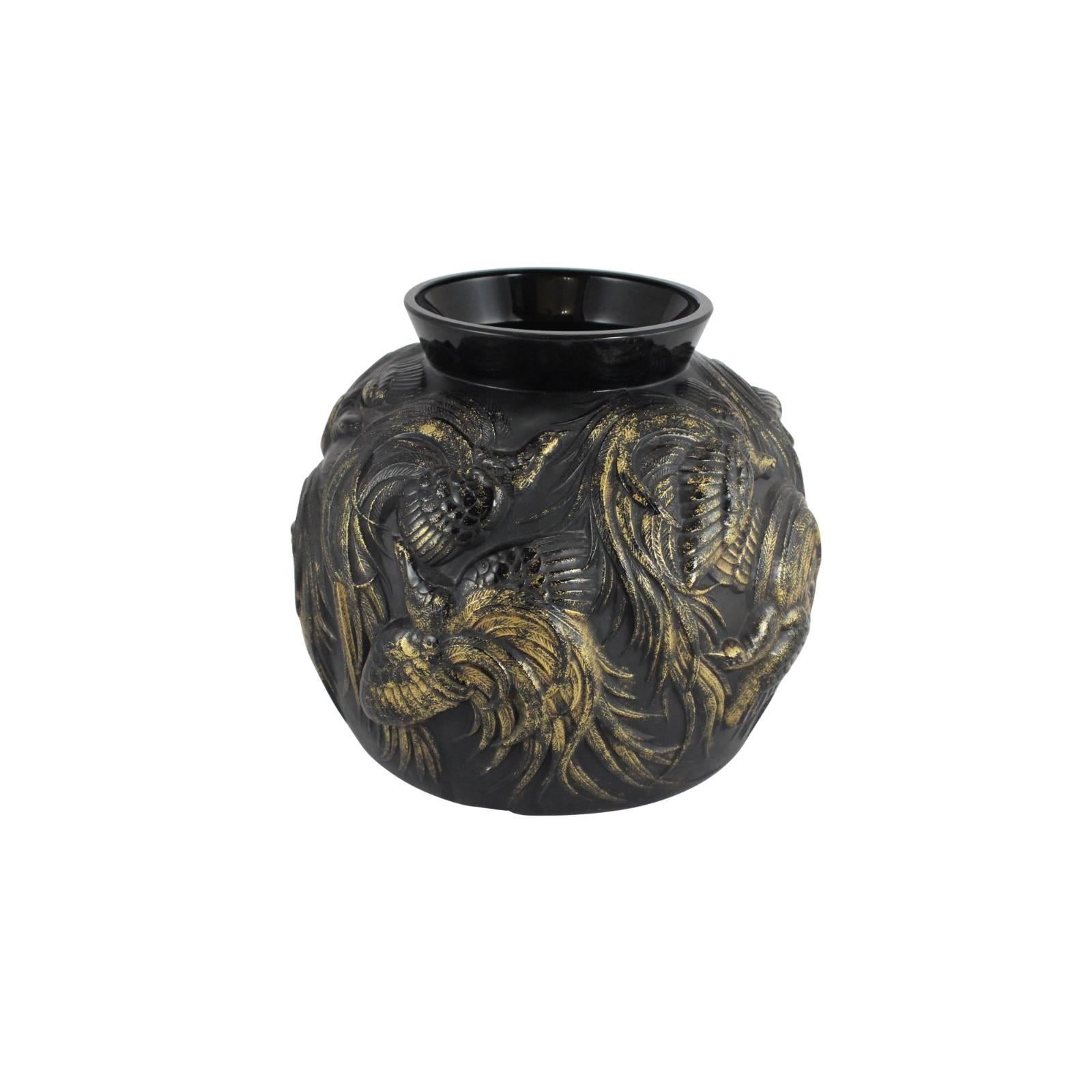 This rare work by Sabino is mould-blown black glass fully embellished with gold enamel and depicts a scene of birds in flight. Signed to base.