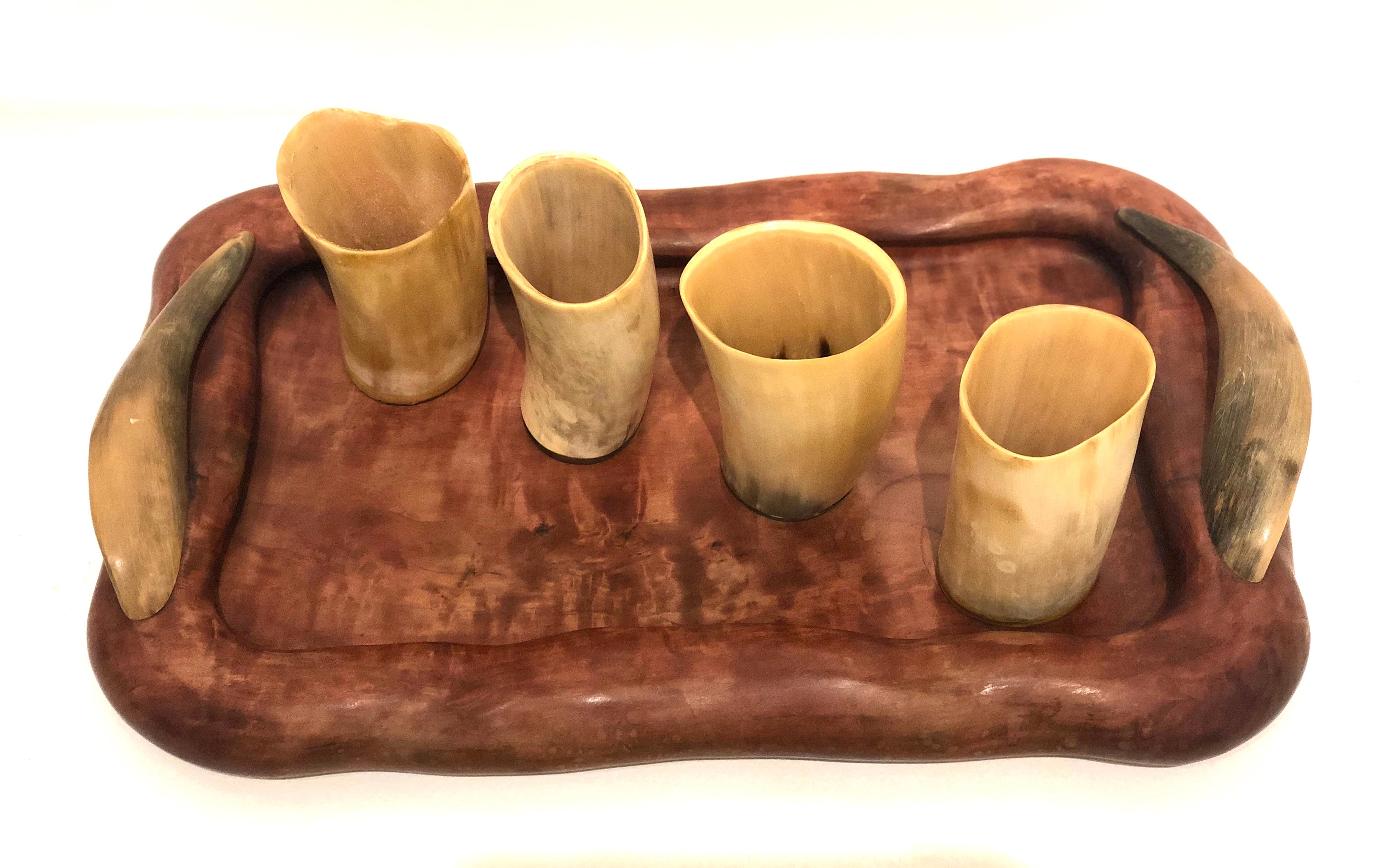 Versatile rare and unique serving tray by French craftsman. Dan Karner stamped at the bottom beautiful wood carved tray with horn handles and 4 horn cups.