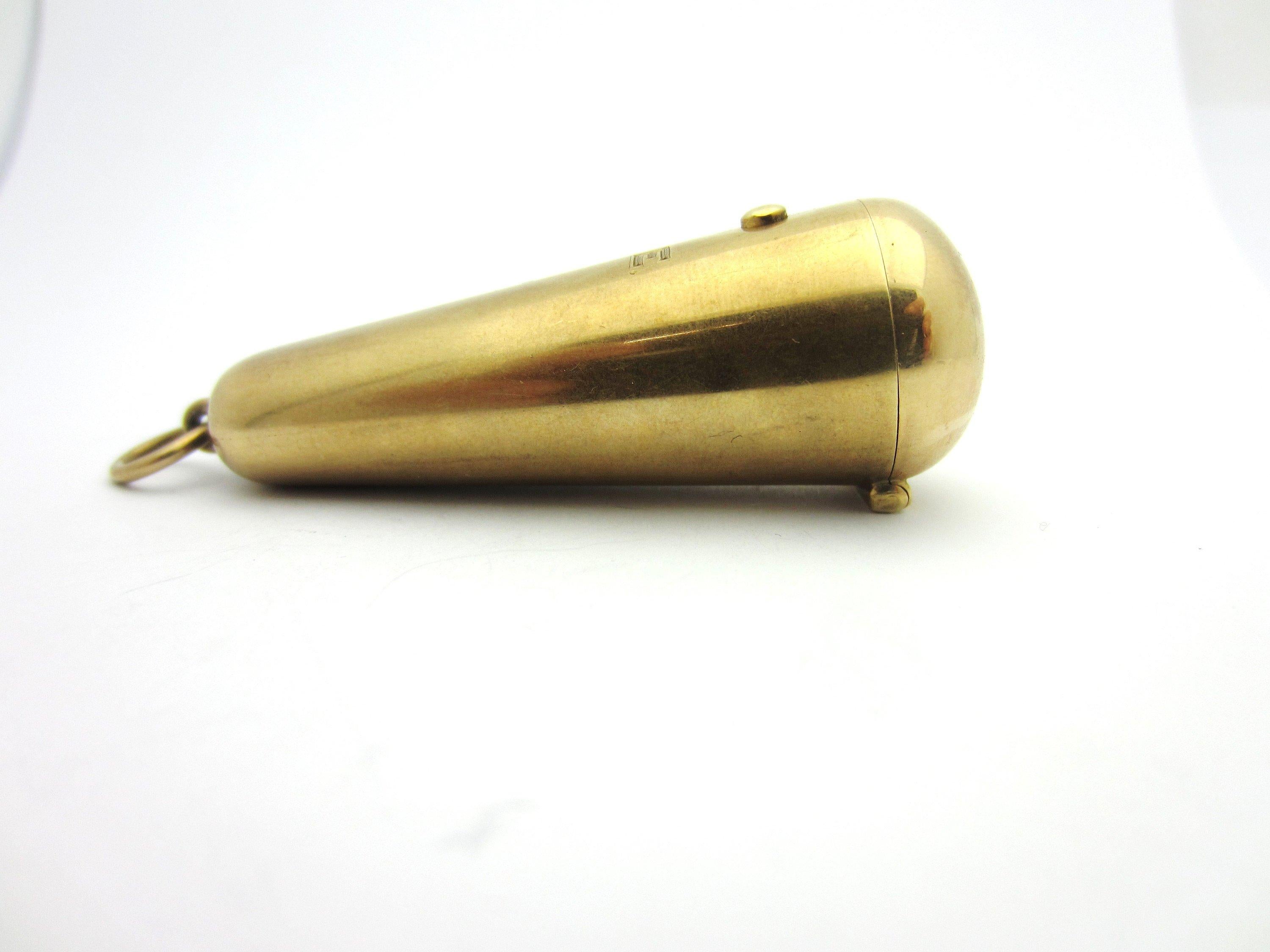 This fabulous Art Deco compartment pendant by Sloan & Co. may have had a number of original uses, such as as a lipstick holder or ash catcher.  It was likely part of a woman's chatelaine. 

Crafted from solid 14k rosy yellow gold, the pendant