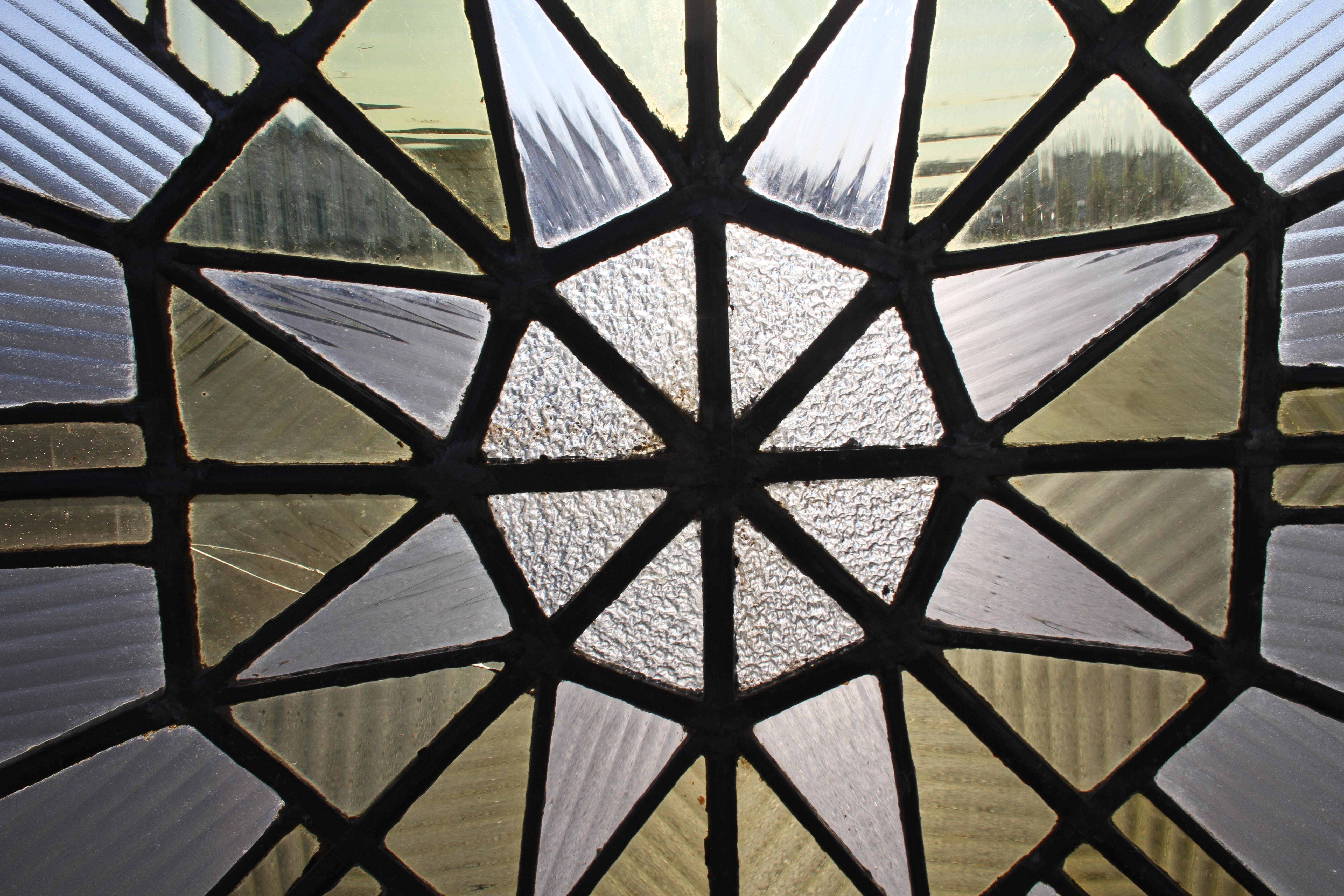 Original 1920s Art Deco stained glass octagonal skylight with chrome frame. Architectural salvage from unknown St. Louis skyscraper or ship, possible the very Deco S.S. Admiral. Chrome frame has loss, older repairs to glass, few cracks not repaired.