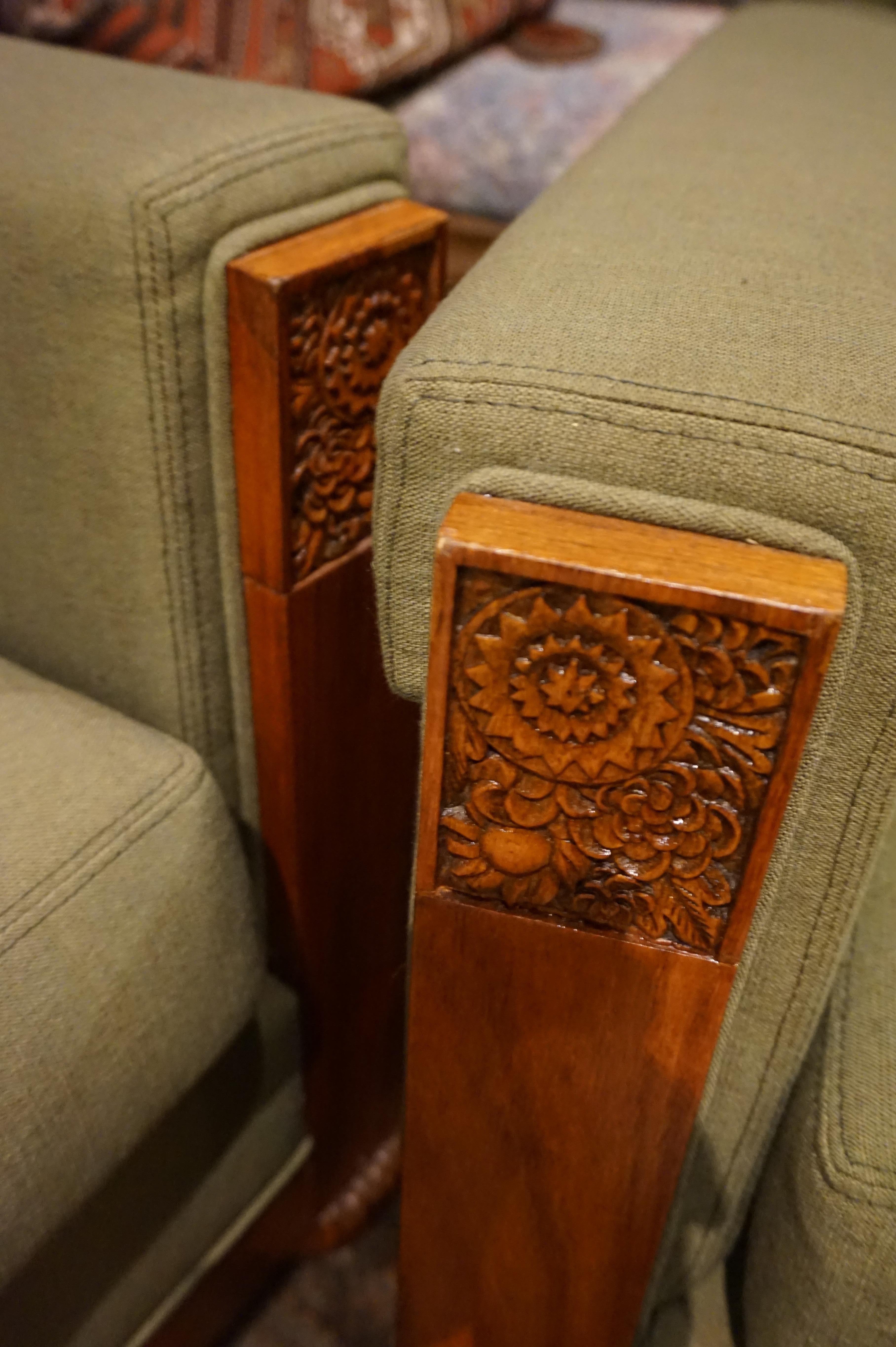 Rare Paul Follot wingback armchairs and settee. Highest level craftsmanship and re-upholstered by a top shop in a calming neutral sage fabric. Beautiful wood grain and fine floral carving very much in the vein of Follot's work. Presents in near mint