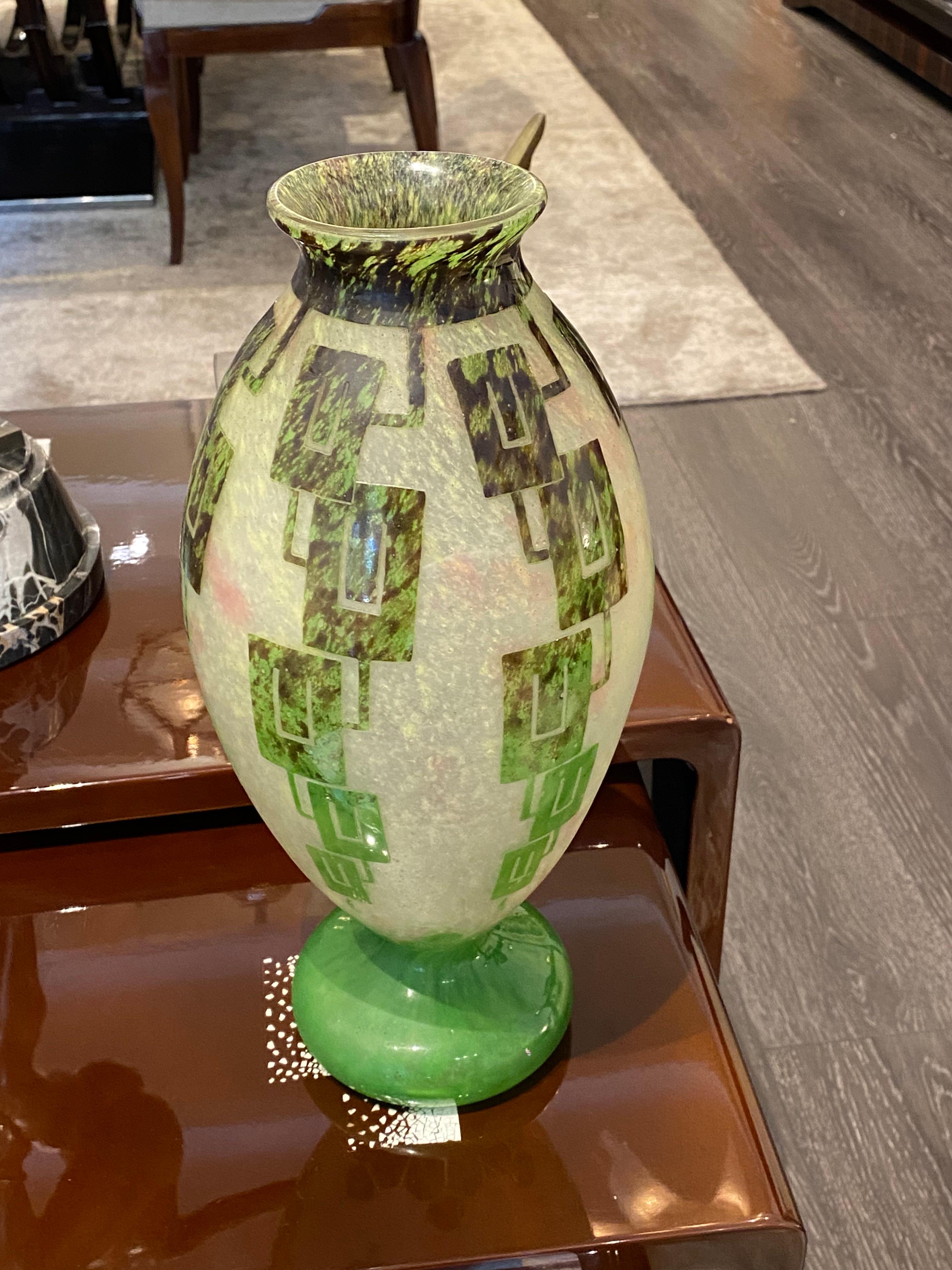 A rare Art Deco Mottled opalescent white, and pink colored glass vase, overlaid with green and black with an acid-etched and wheel carved to the Frenes pattern by Le Verre Francais under Charles Schneider creative design.
Made in France circa
