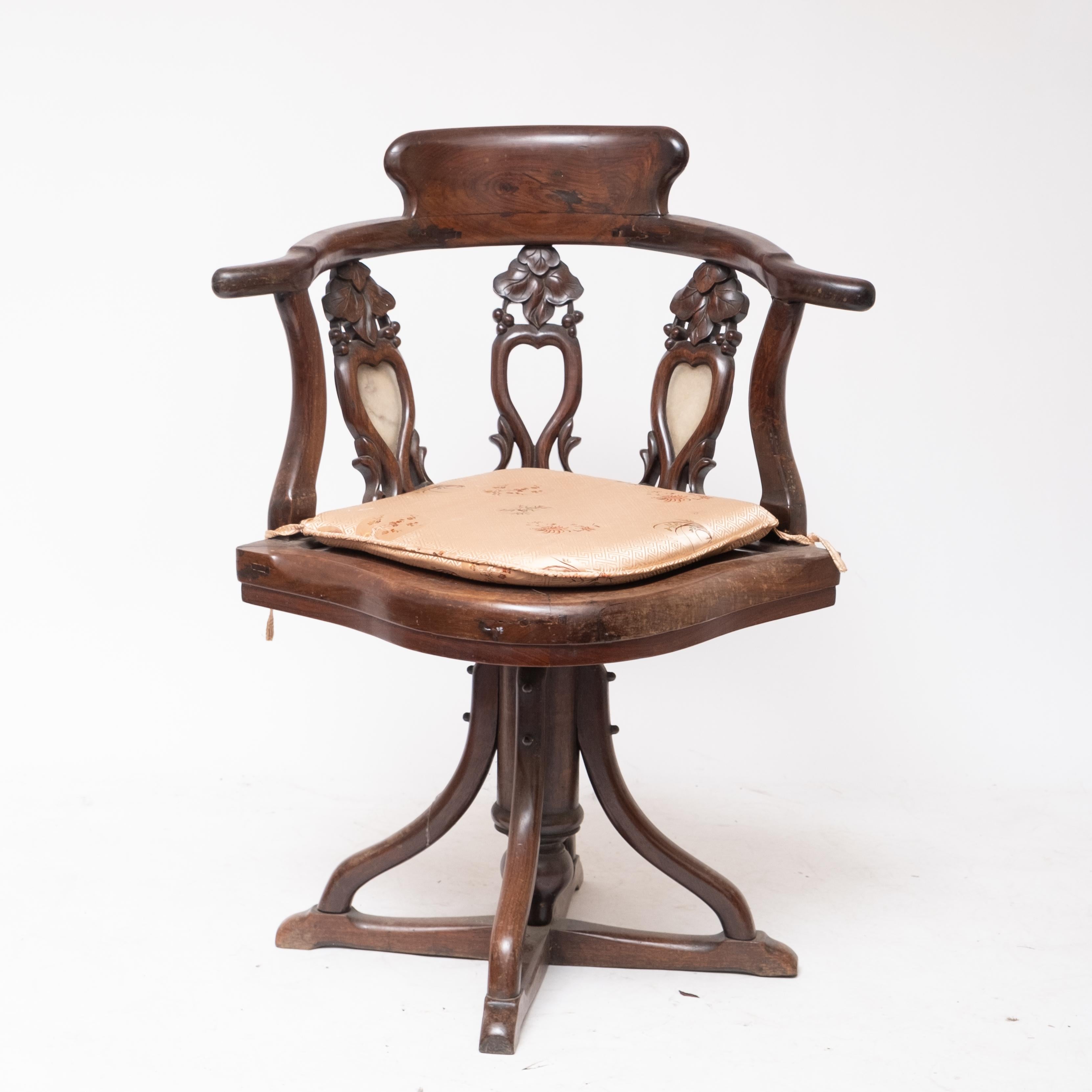 Art Nouveau Chair. The chair is a swivel adjustable desk or vanity chair, floral carved Rosewood and Marble, Probably Chinese export for European market circa late 19th Century.