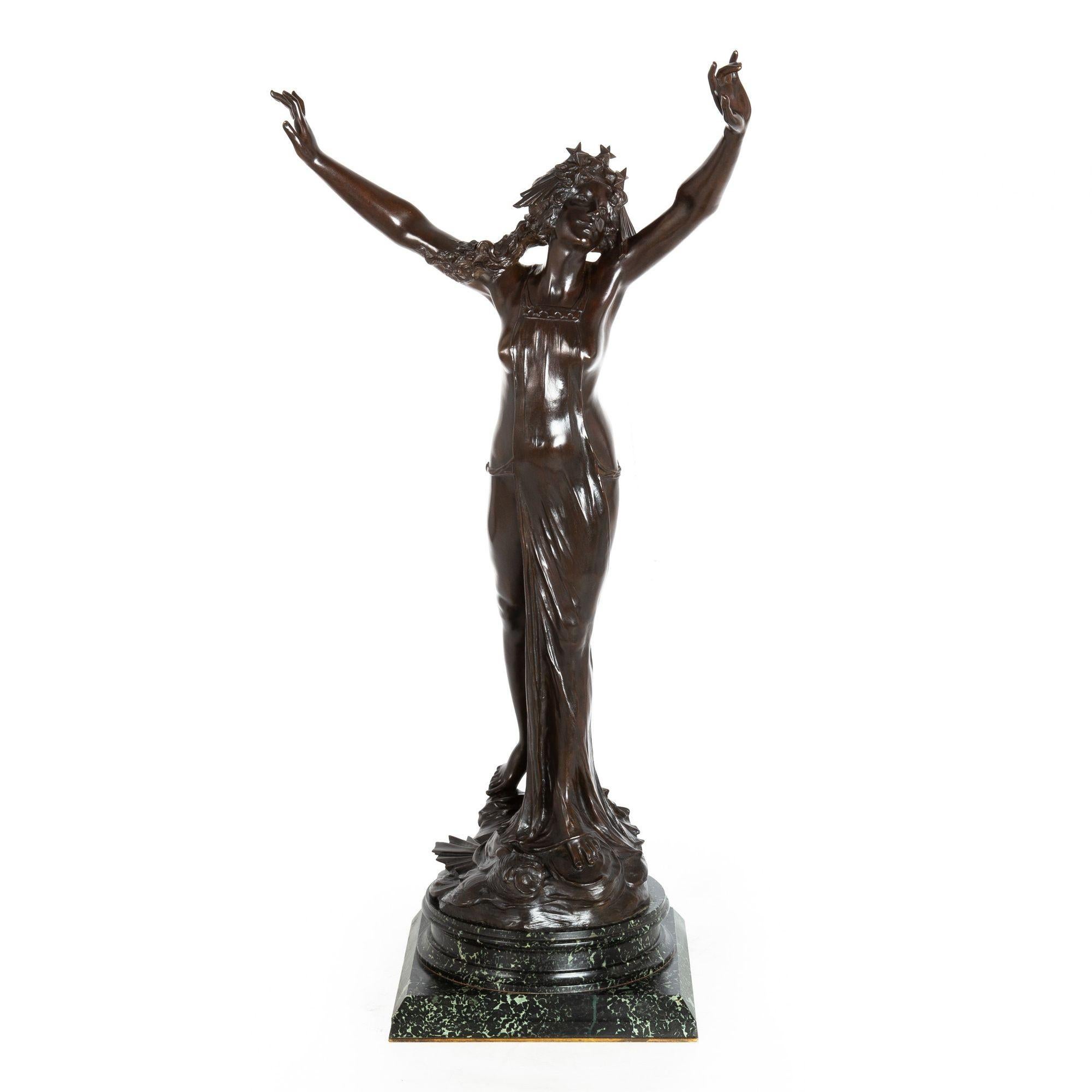 GEORGES FLAMAND
French, fl. 1895-1925

Ariadne and the Corona Borealis

Dark-brown patinated bronze over verde marble on bronze rim  signed in base 