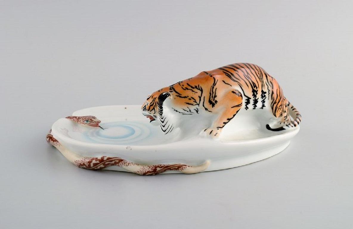 Rare Art Nouveau Stadt Meissen porcelain figure / bowl. Tiger and snake. 
Early 20th century.
Measures: 23.5 x 8 cm.
In excellent condition. Minimal and insignificant chip.
Signed.
1st factory quality.